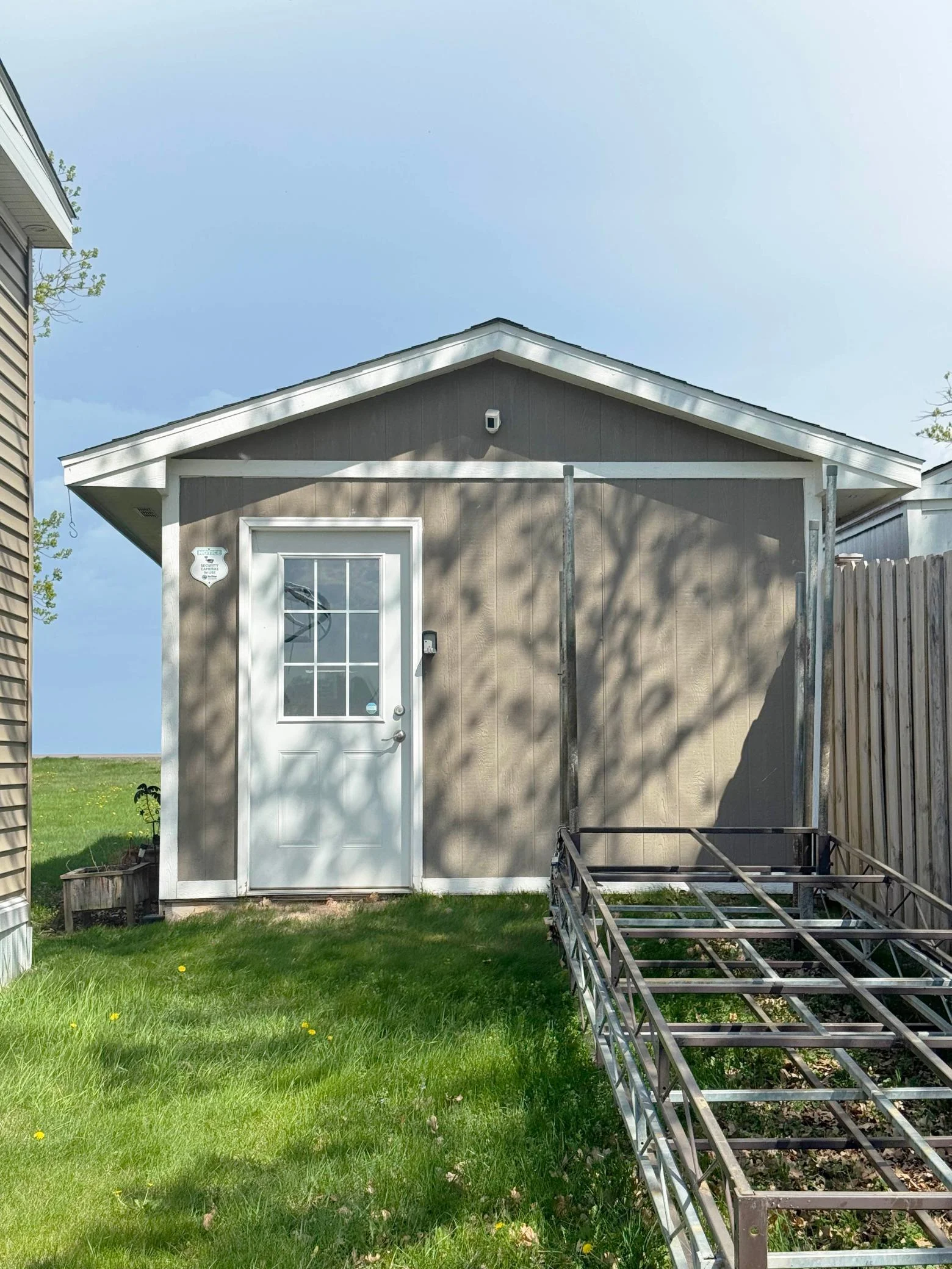 Looking towards the garage's rear entry door from the backyard.