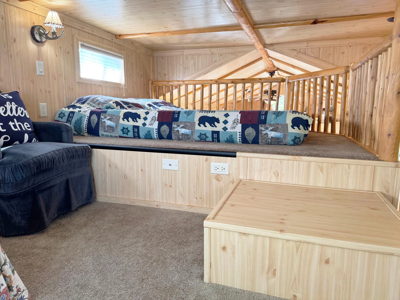 A look at the upper level loft space....this has a low ceiling but is cute as can be and a great space to house family or guests!