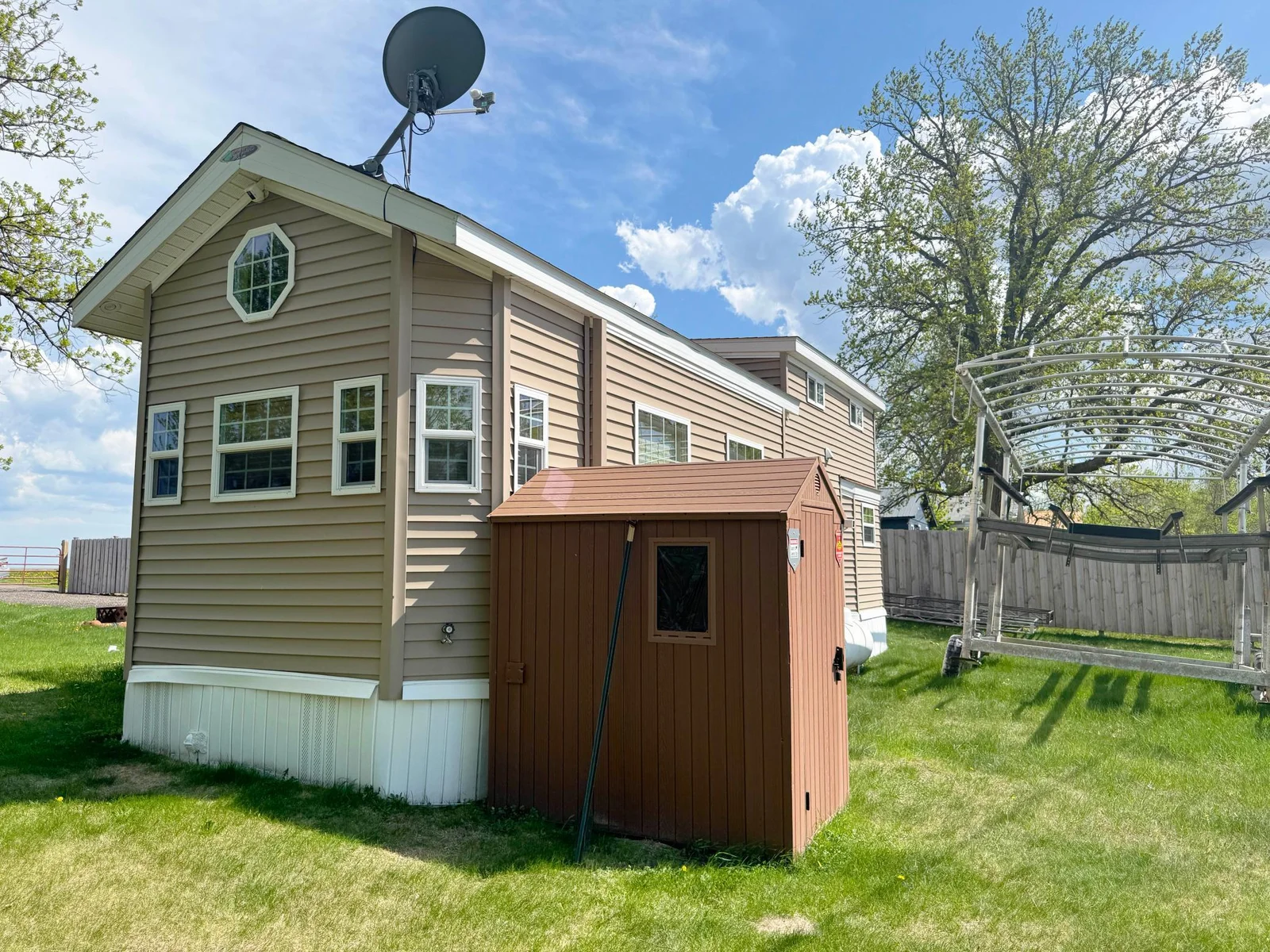 Another angle of the exterior, and the well shed where the water softener is located.