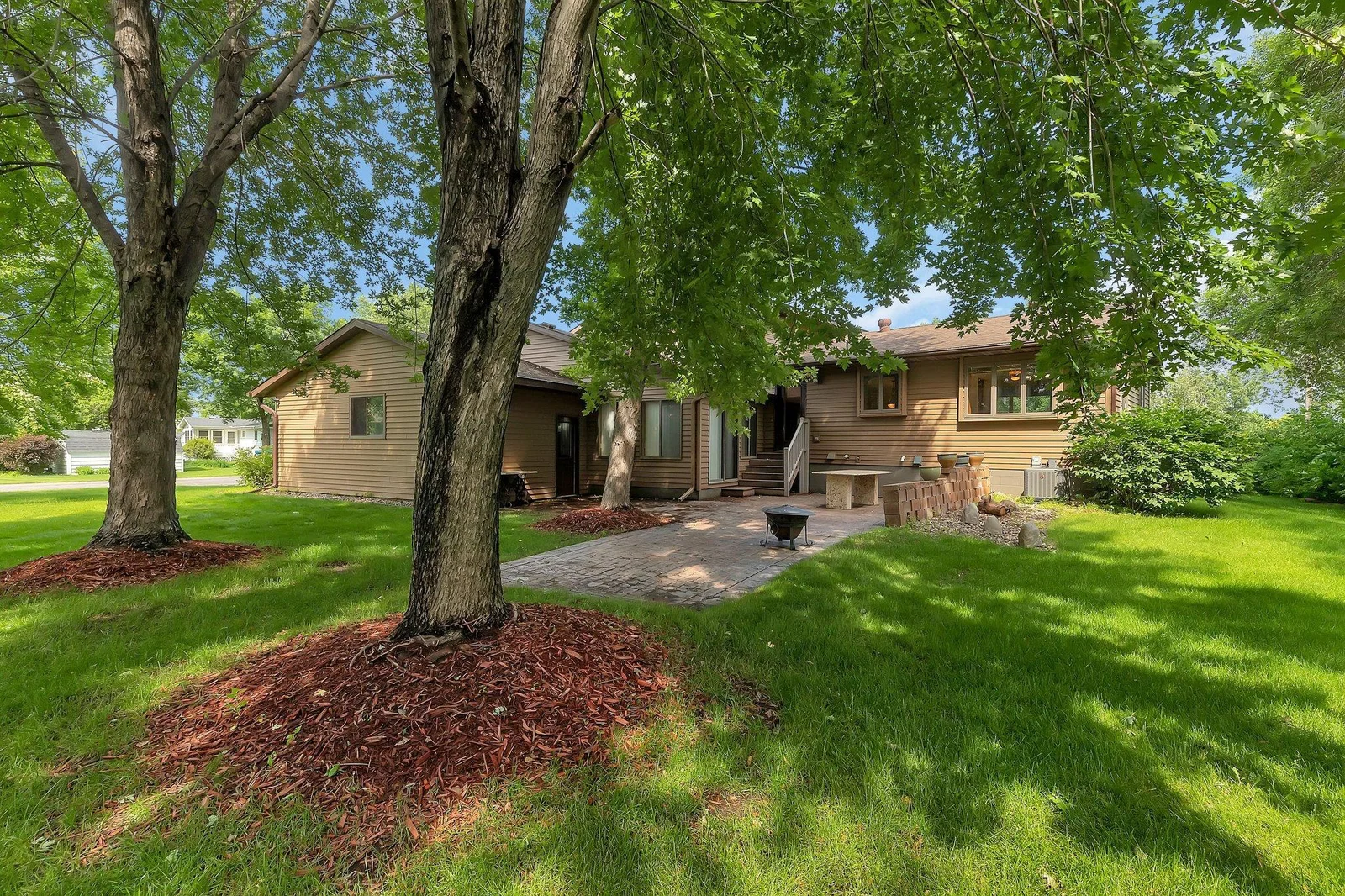 Mature trees in the backyard create a relaxing space after a round of golf or a day on the lake!