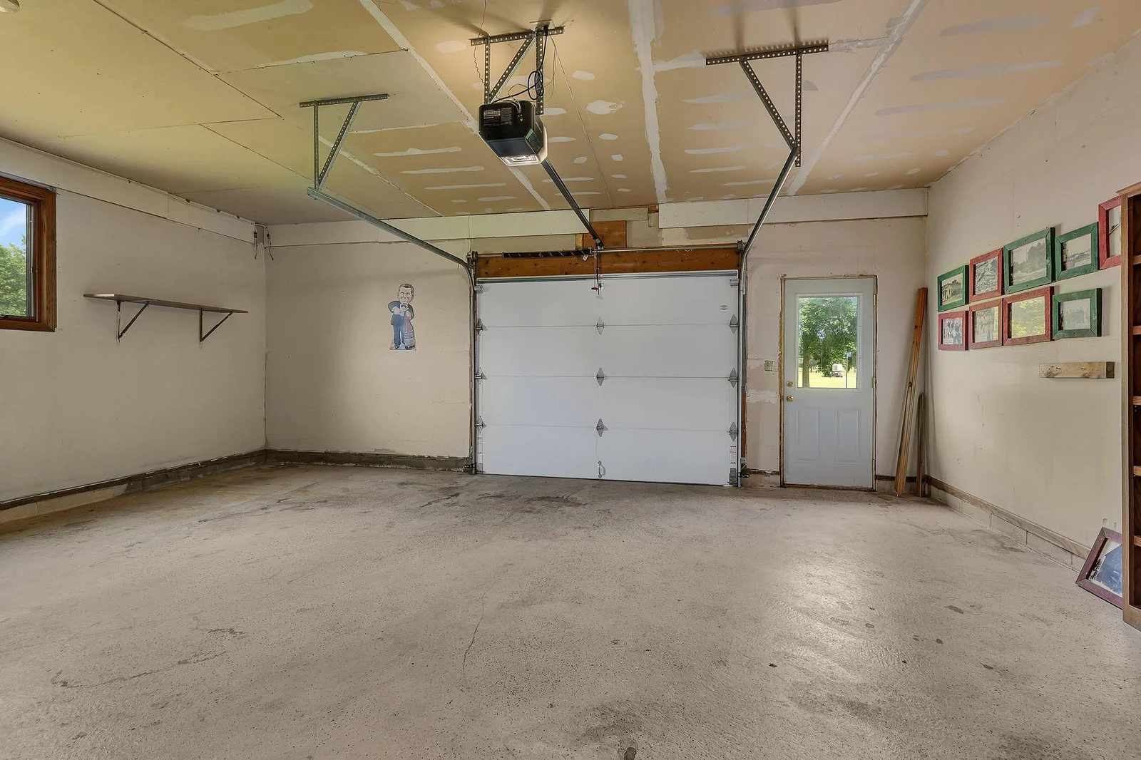Front facing oversized 1 stall attached garage - perfect for storing golf carts