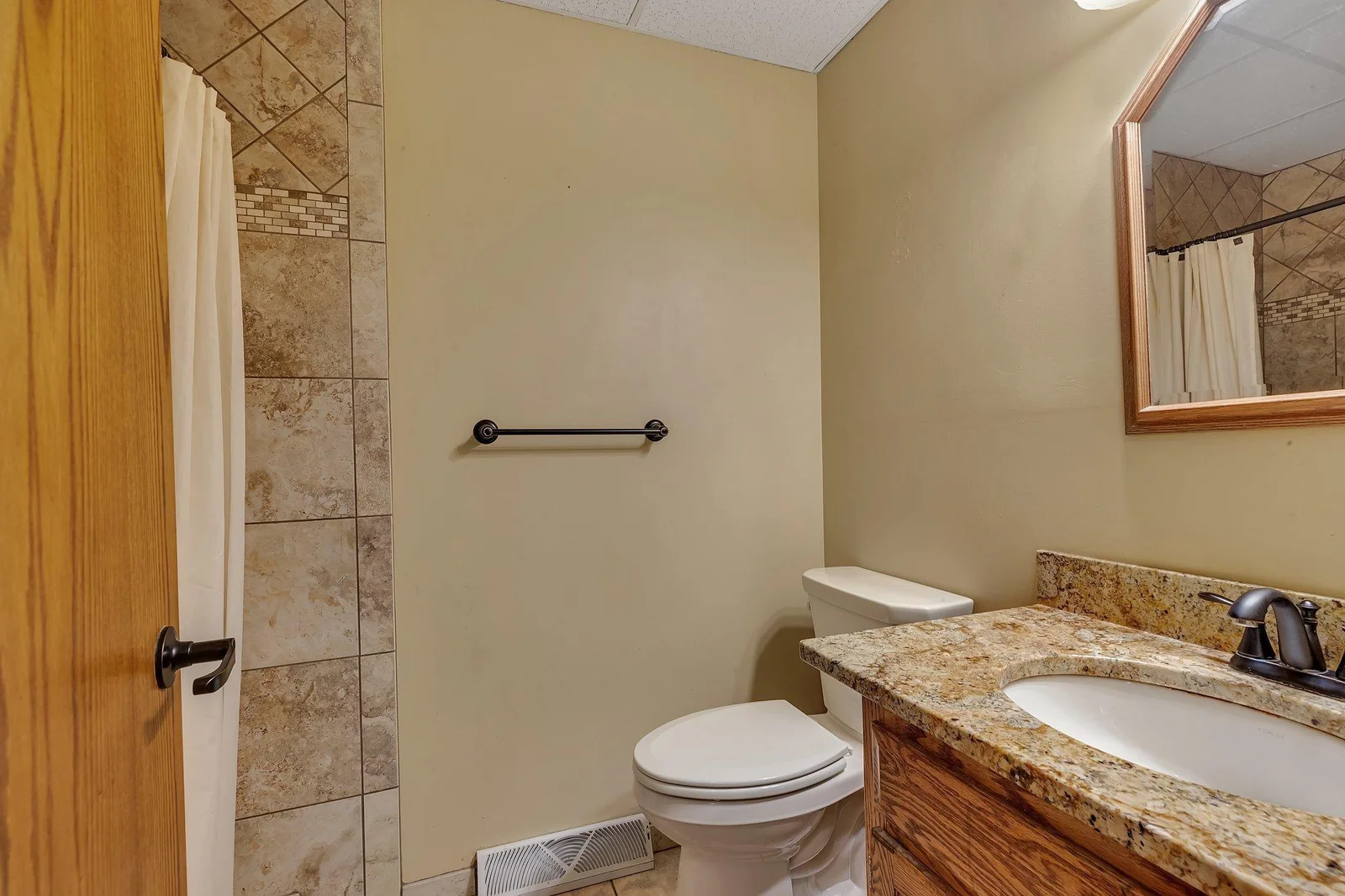 3/4 bath for main living spaces. Located by laundry and garage entrances