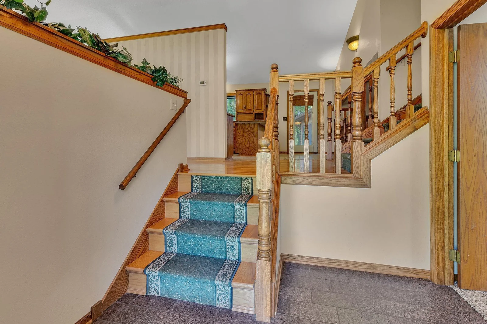 Granite floor in entry with access to the office to the right