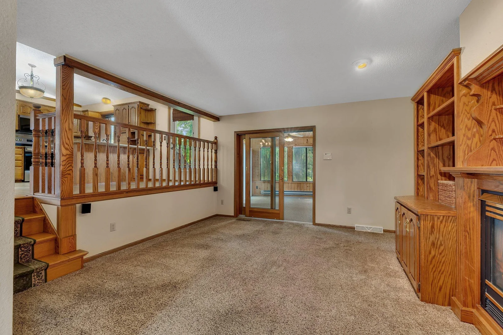 Additional living area with sightlines from kitchen, main level living room, office and sunroom