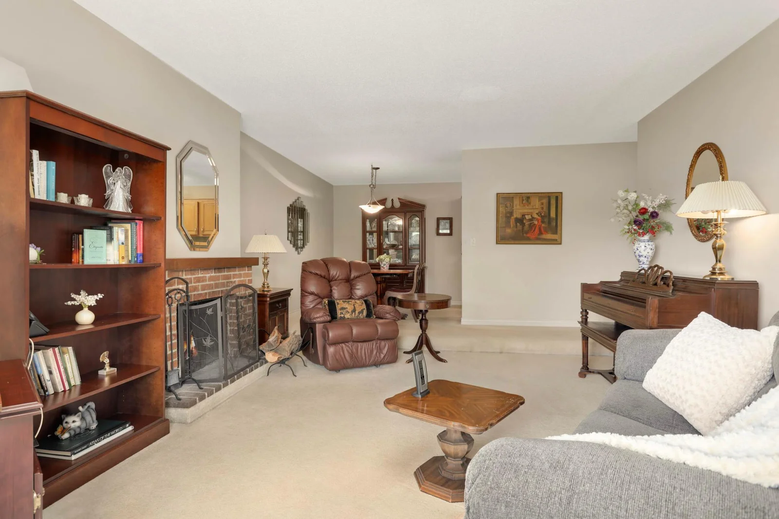 Living room with wood burning fireplace.