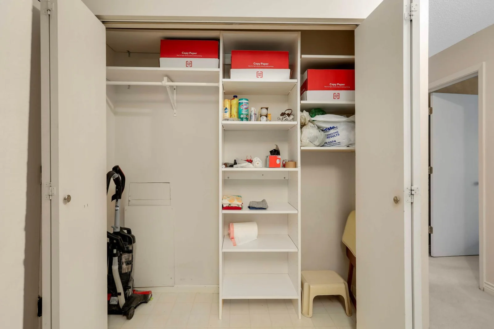 Front entry closet with california closet system.