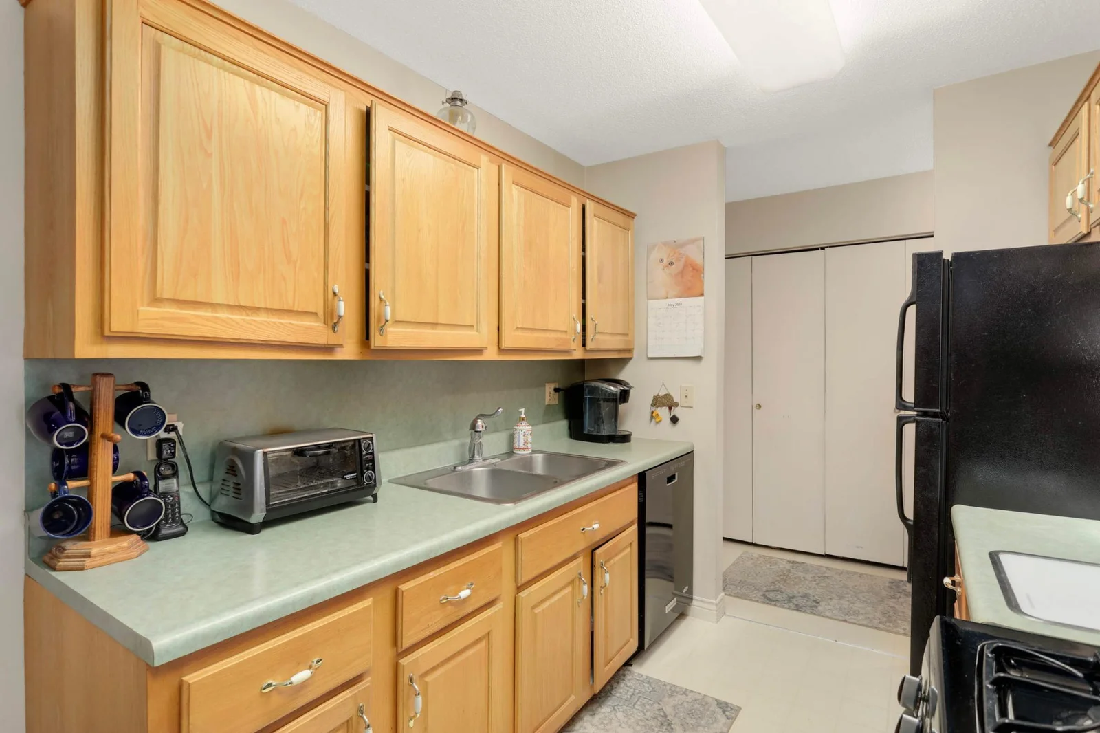 Kitchen with newer dishwasher.