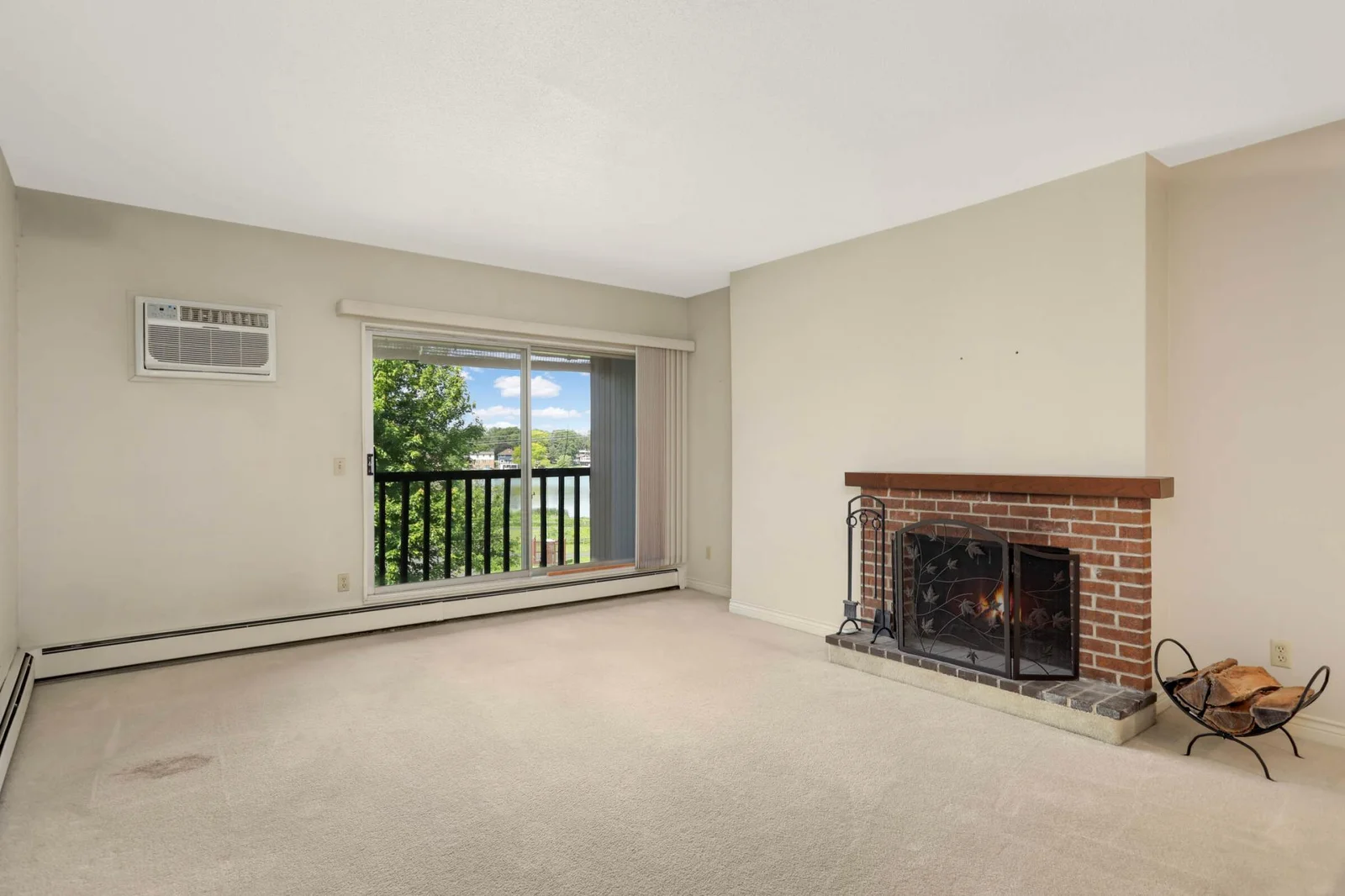 Living room with views out to the green space and park.