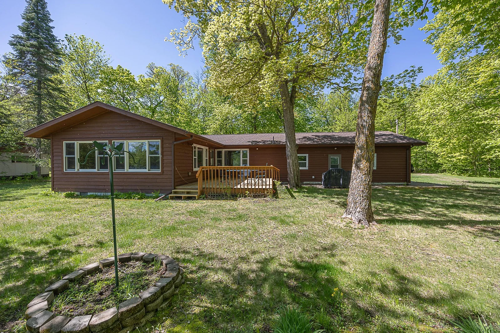 Additional view of lakeside of home.