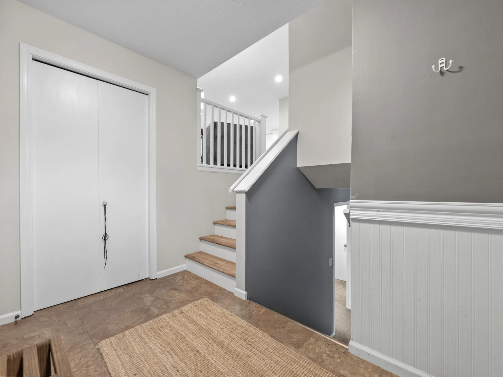 The spacious foyer offers a warm welcome with plenty of space for guests to arrive comfortably.