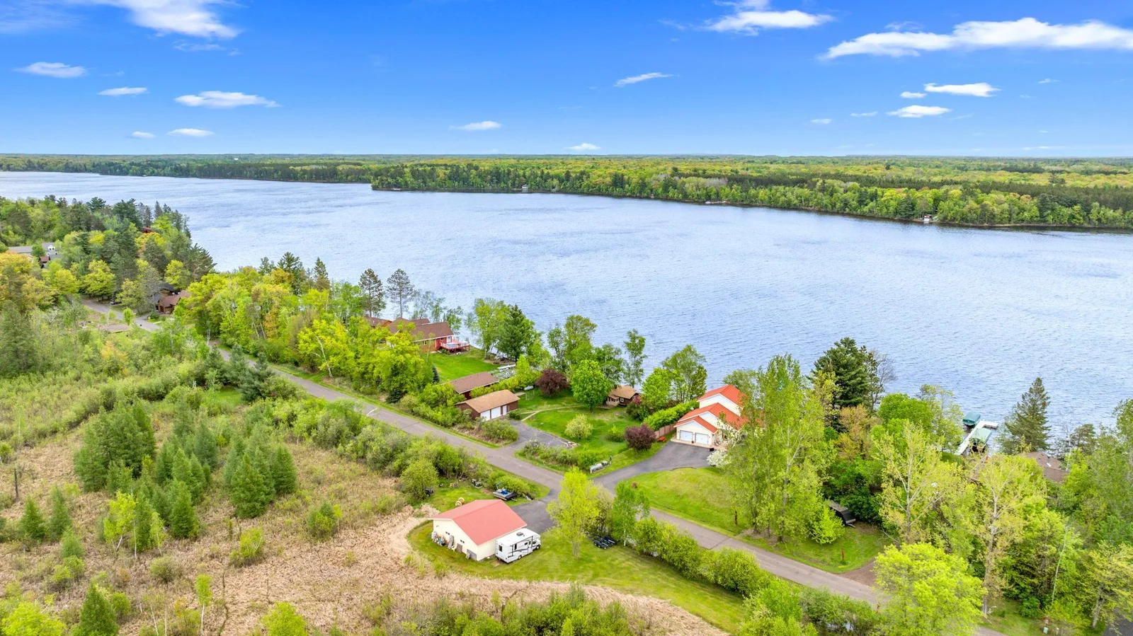 Over an acre of land and 100 feet of lakeshore frontage