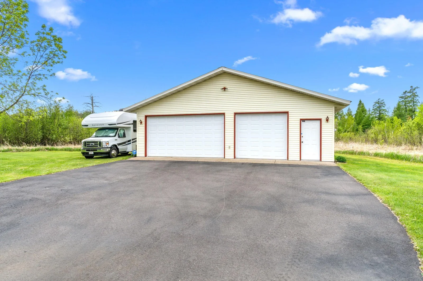 3 Car Detached Garage and Extra Land Across the Road Ideal for Extra Storage!!