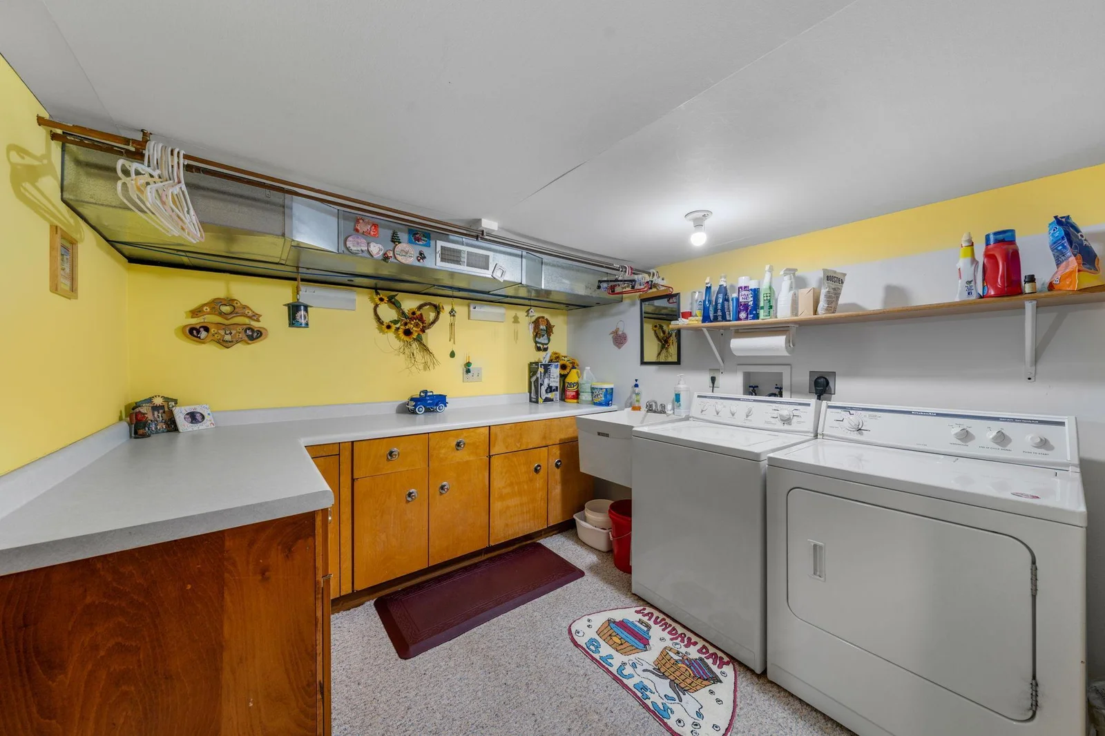 Laundry Room offers plenty of storage counter space and a sink