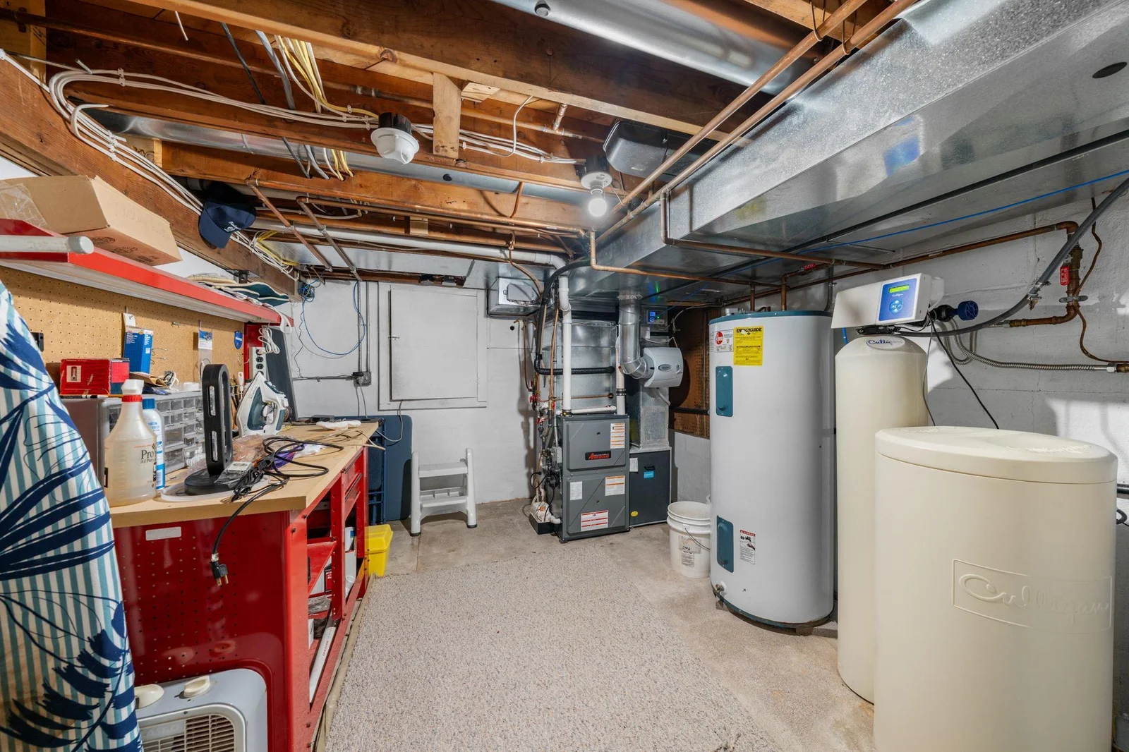 Large utility room, new high efficiency furnace with a heat pump and access to a huge storage area