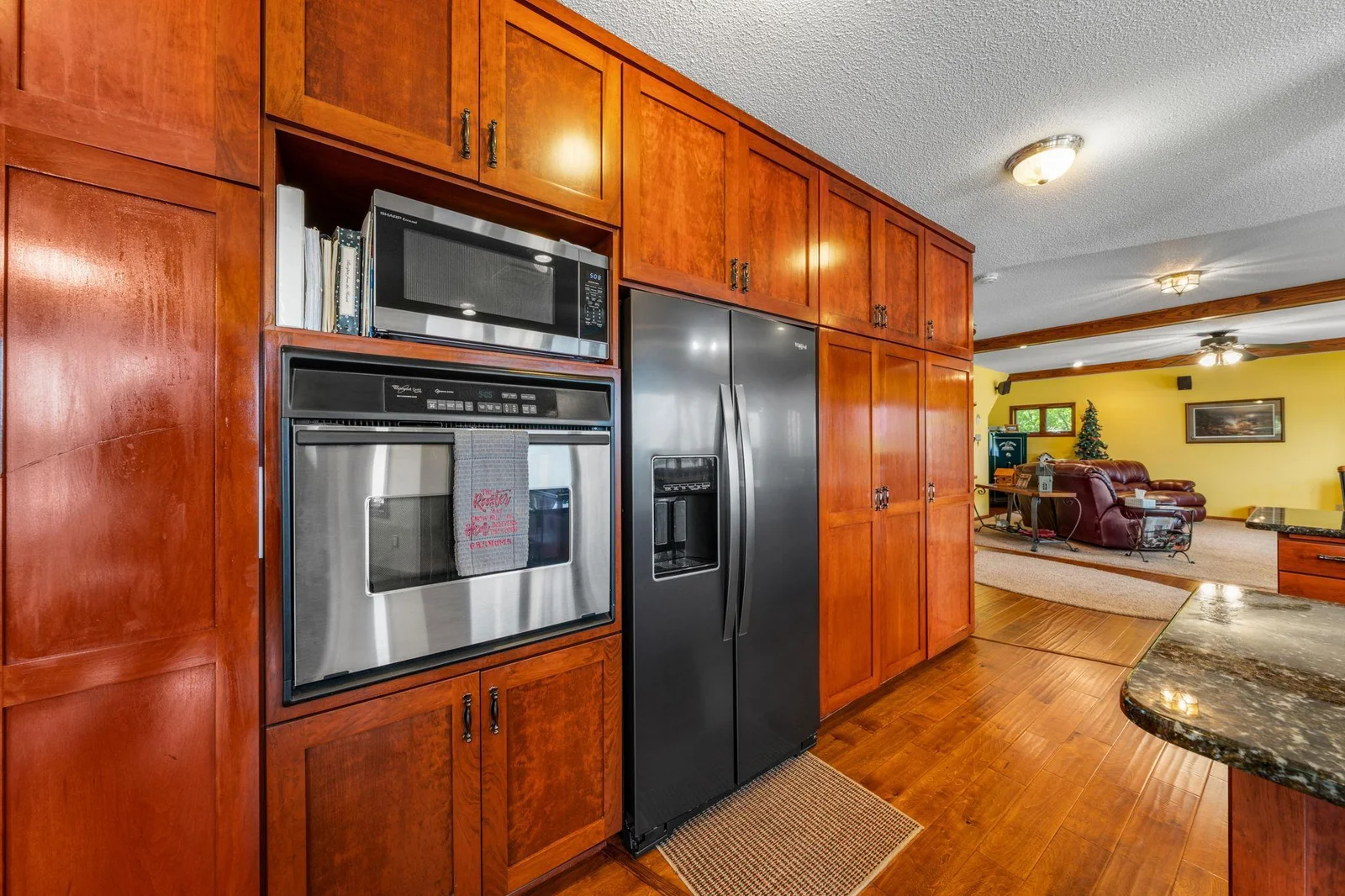 Wall of Cabinets with Plenty of Storage and Built In Desk area