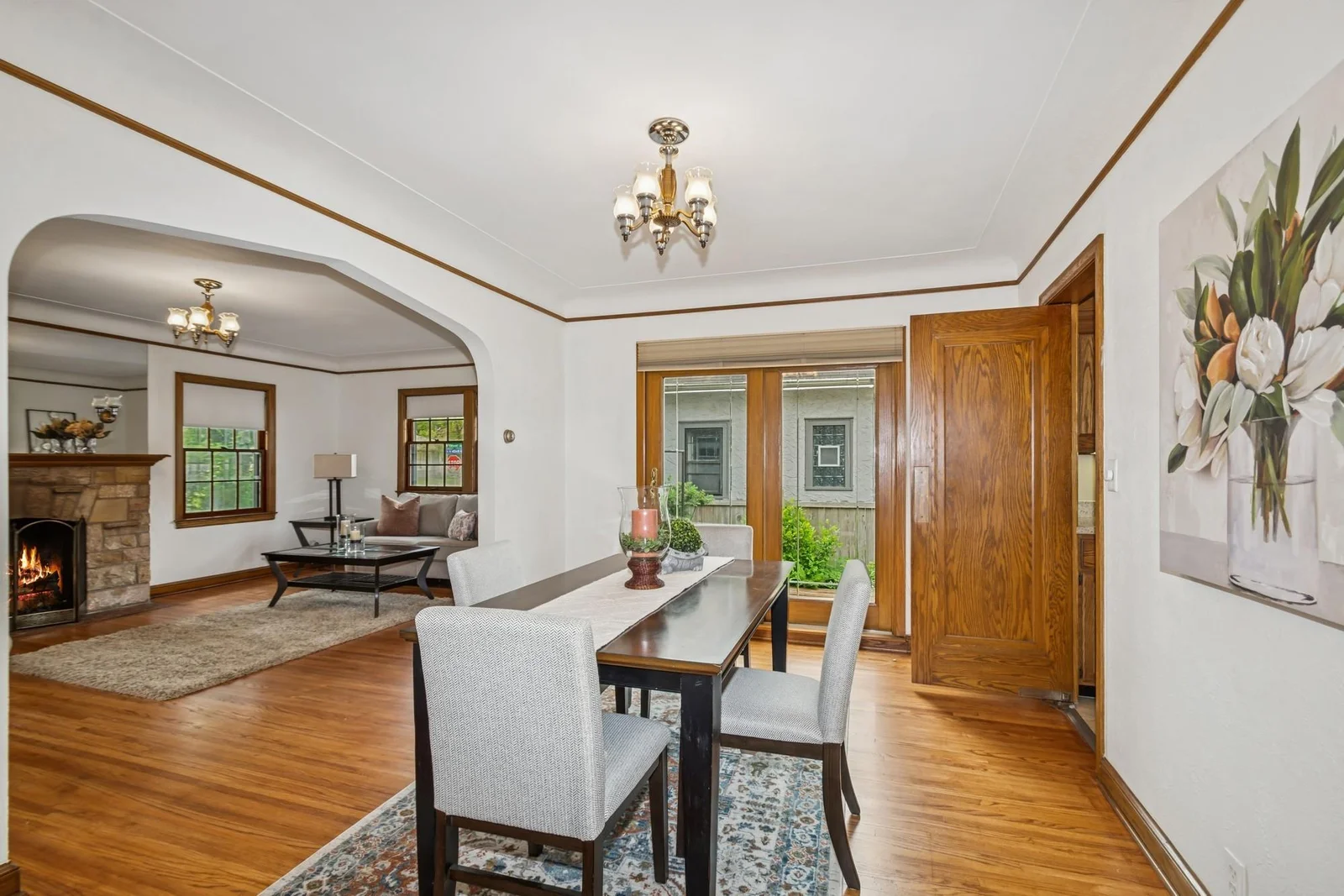 Dining room slider door is a nicely updated door that takes you out to the side yard  deck- which would be a great place to put your grill or smoker