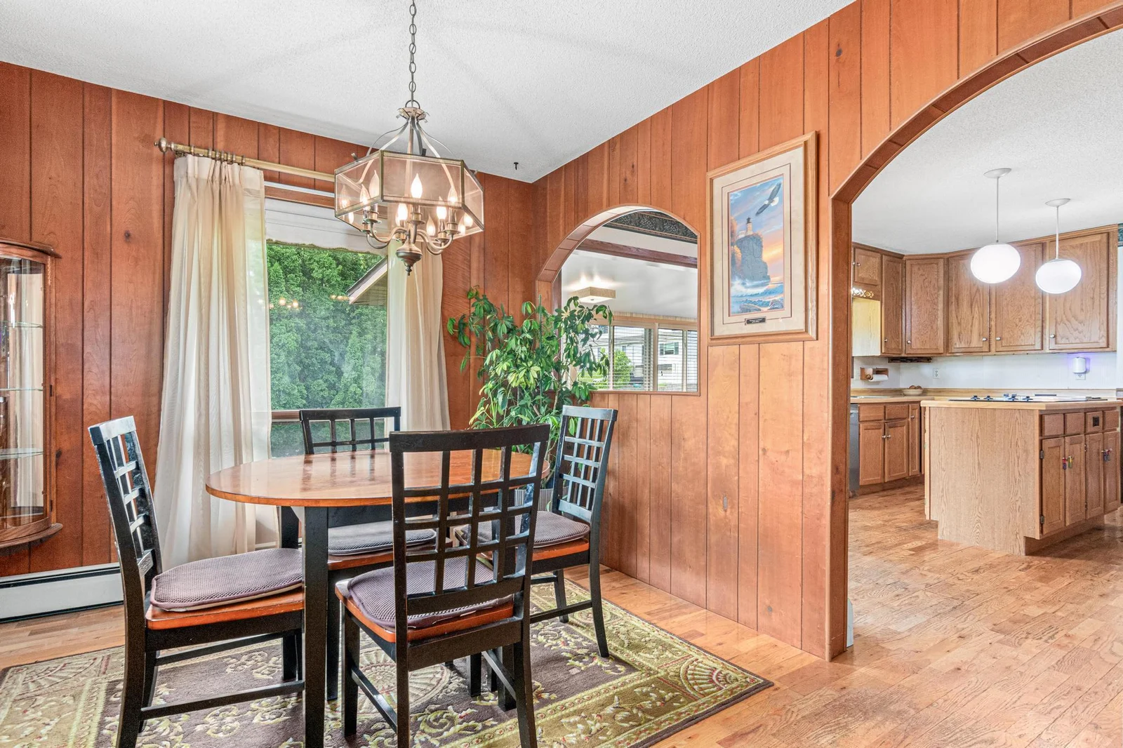 View of dining room to kitchen and through to sunroom.