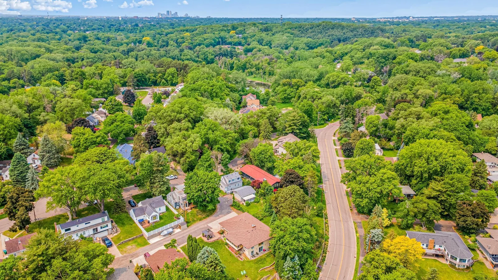 Aerial view of the home to the West with the Minneapolis skyline in the distance.