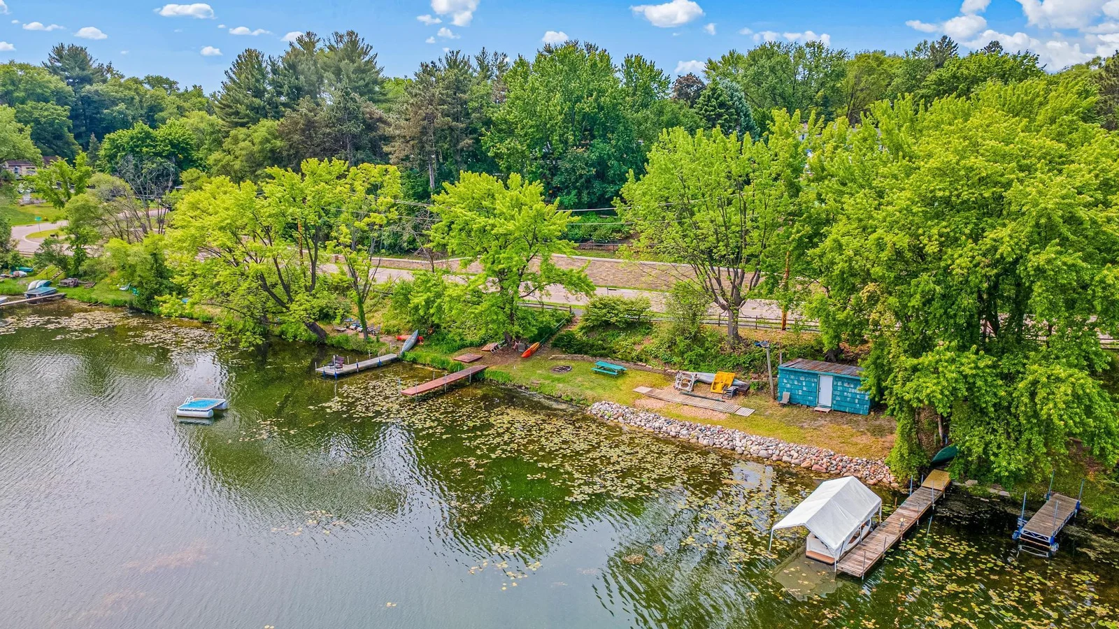 With nearly 100 feet of shoreline and a warming house with electricity and baseboard heat, you can enjoy the benefits of lake living year round from water skiing to ice skating!