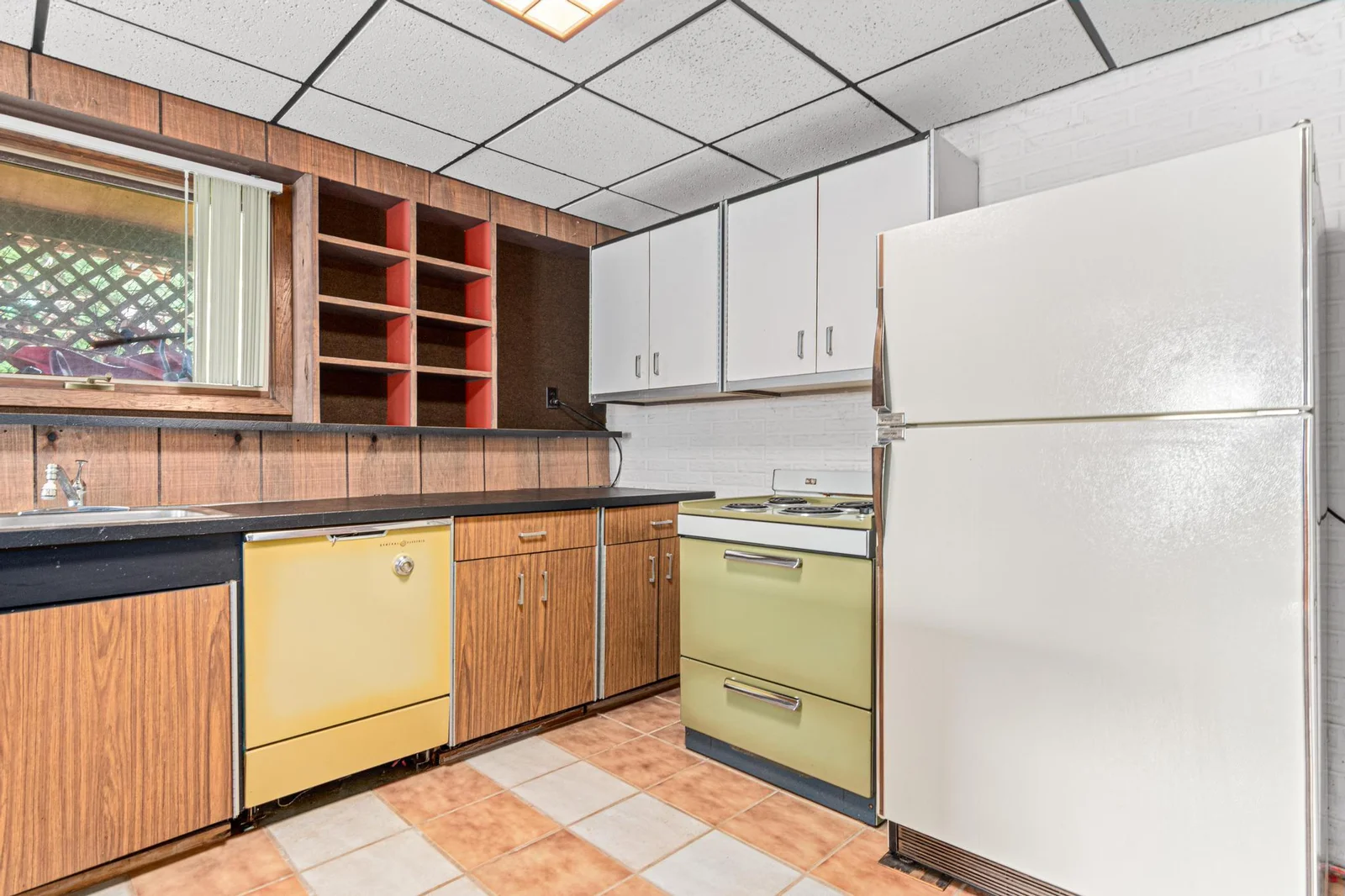 It might be original, but it all works! This 2nd kitchen is adjacent to the family room. The lower level could be easily divided to be completely separate from the main floor of the house. The lower level makes for great in-law suite.