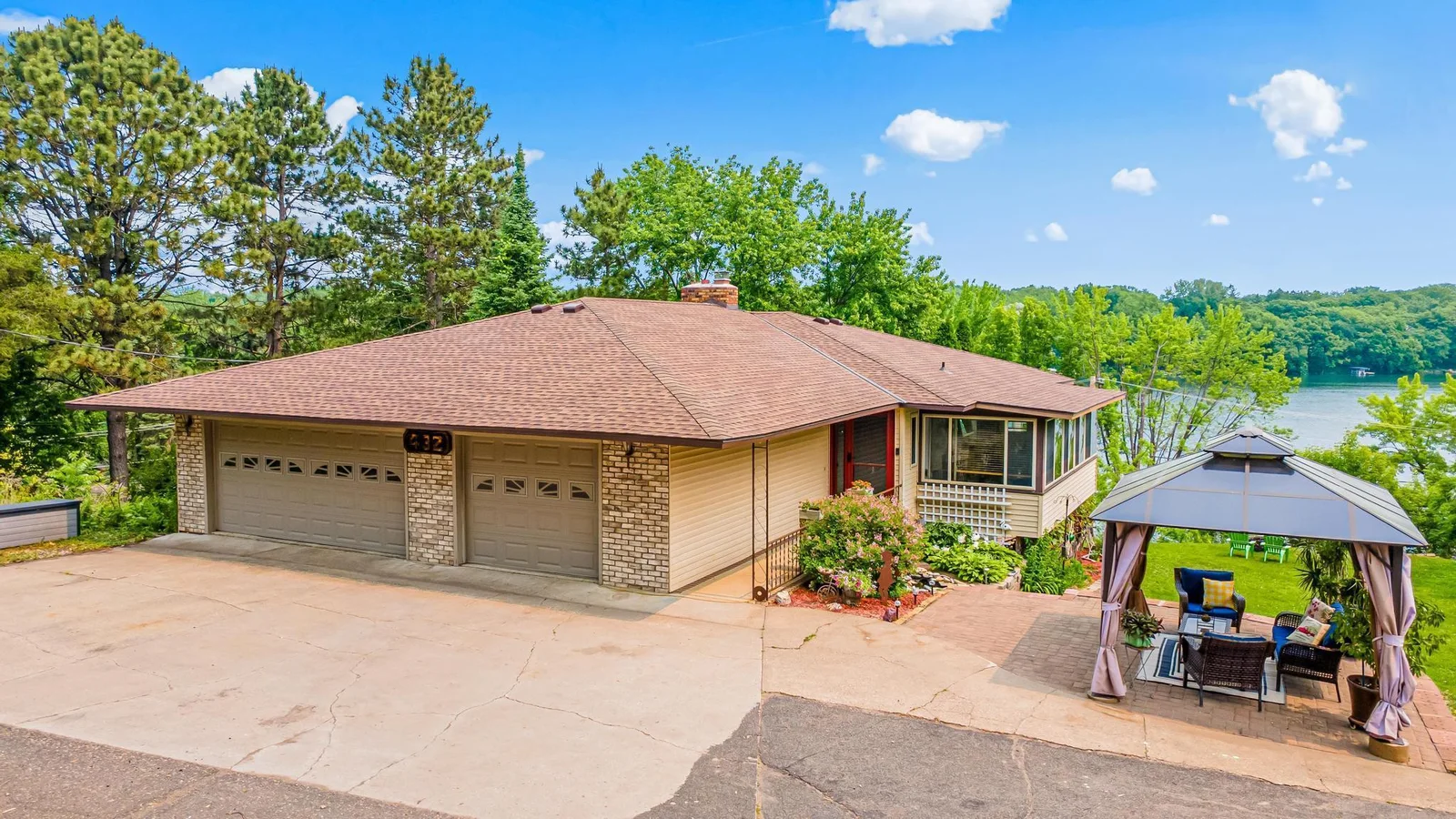 Built in 1977, this home has been lovingly cared for by the original owners for the last 48 years. Perched up on the hill, it has wonderful views of the lake and a private yard, and it is set up for full main-level living.