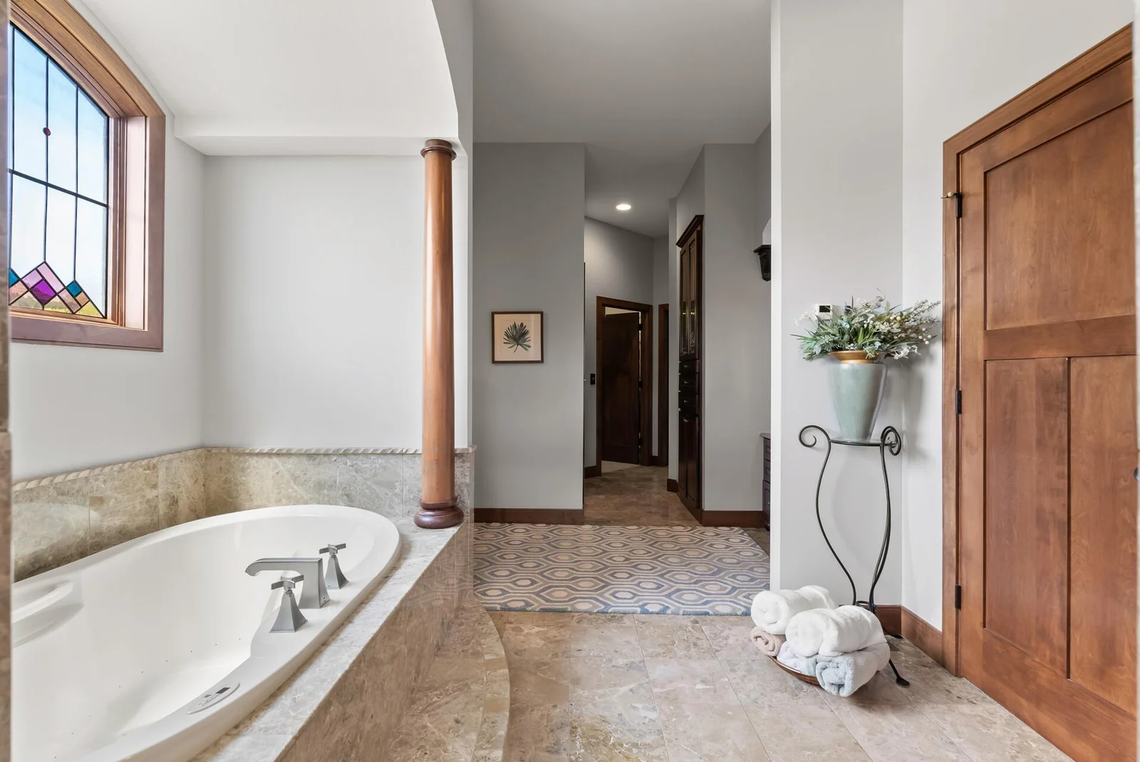 Beyond the sink is the water closet, 2 clothes closets and back entrance to office/nursery.