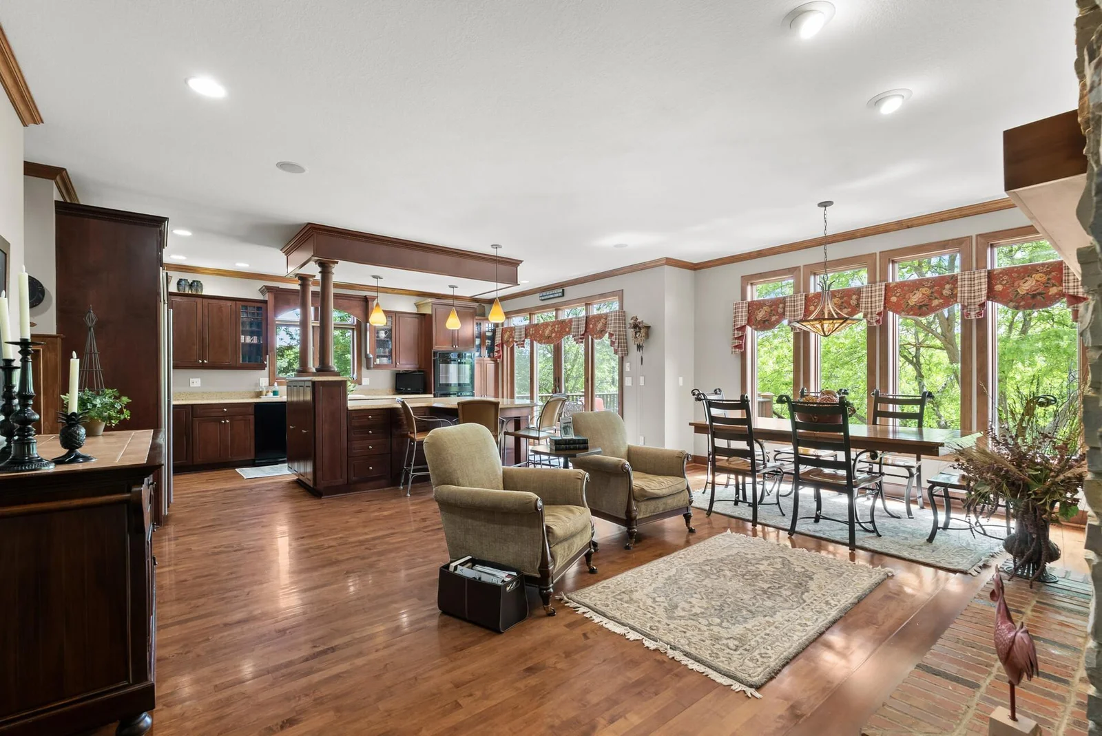 Kitchen/dining area is great open space for all to gather with windows all overlooking the river view