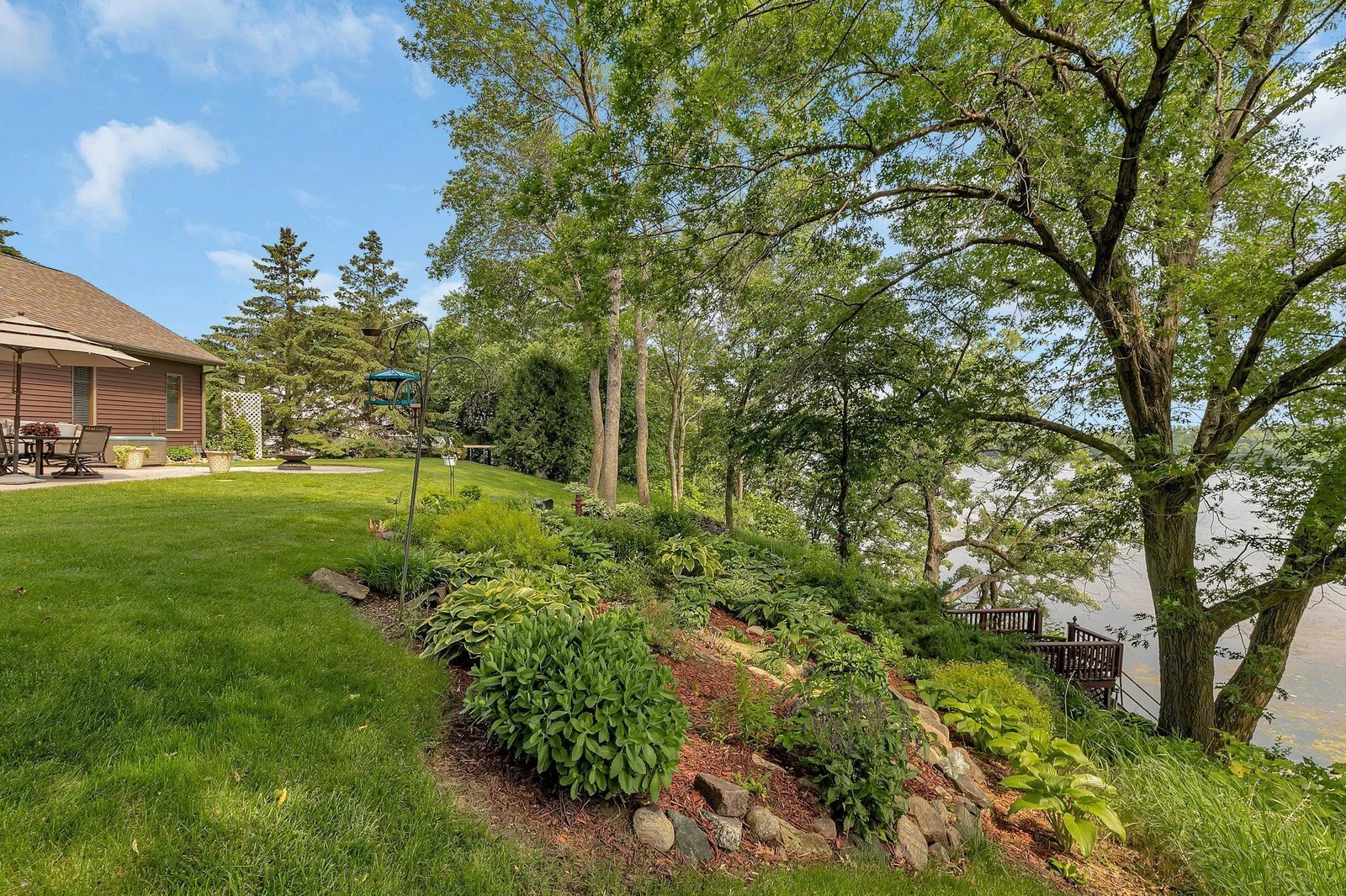 Lakeside hill is full of perennials that help to prevent erosion. Nice size lakeside deck is great for enjoying even better lakeviews.