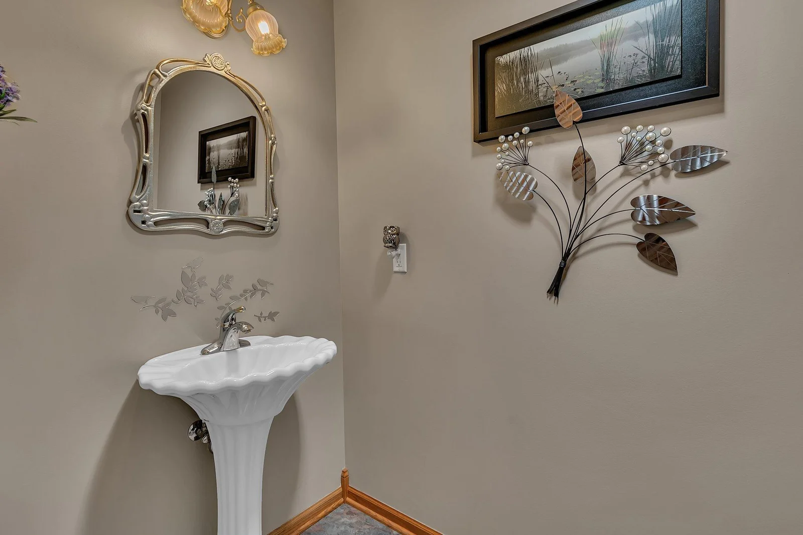 Main level hallway half bath with tile floors
