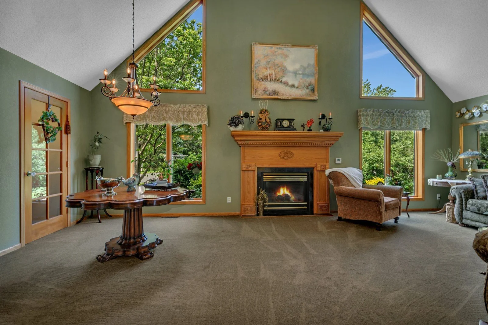 Beautiful vaulted dining area with china closet is perfect for hosting holidays or entertaining alike. This is a beautiful large versatile space.