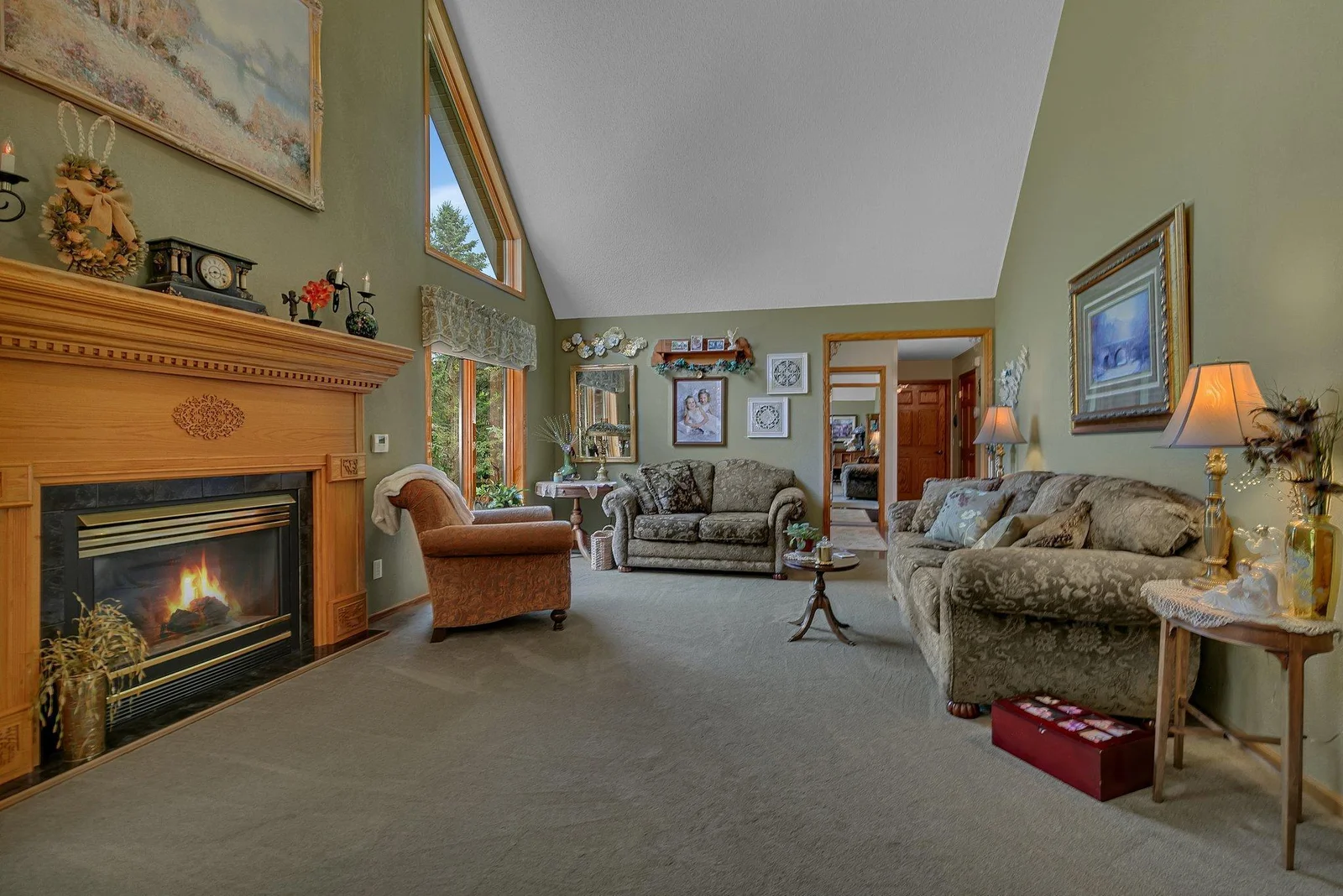 Enjoy evenings in the large living room around the cozy gas fireplace. Vaulted ceilings and large windows give an even more open feel.