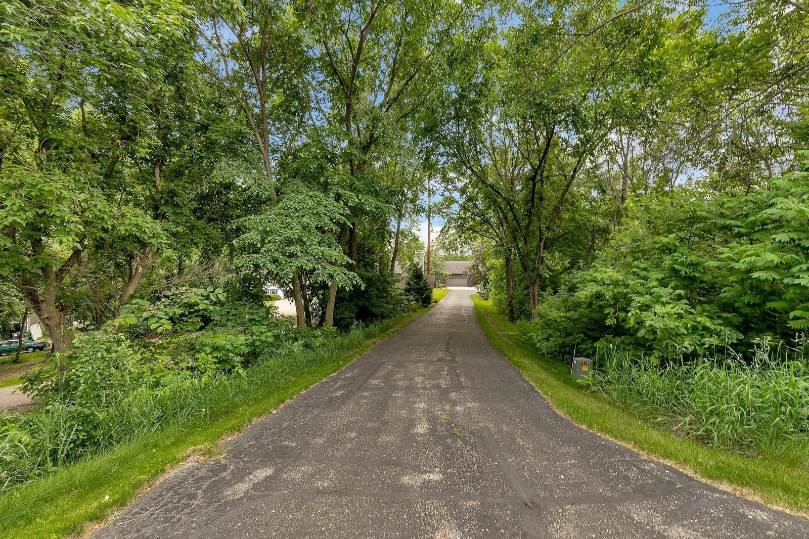 Long private driveway adds additional privacy to this already large & private lot.