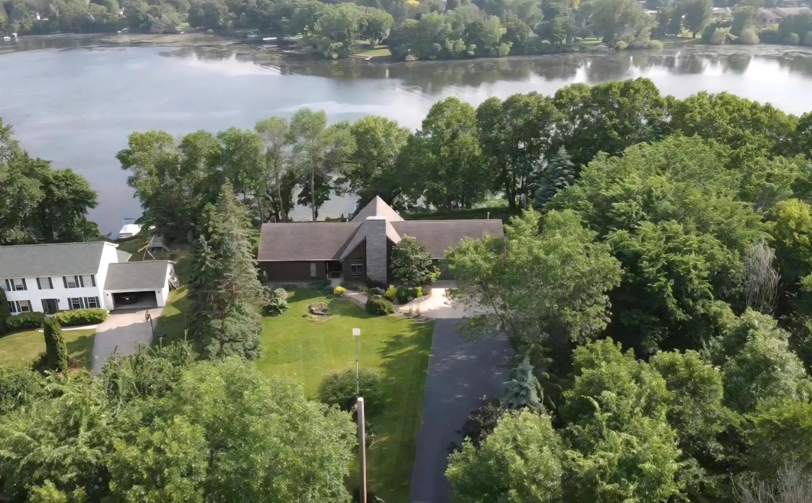 This gorgeous custom built home awaits you! Situated on a large .86 acre lot with 174' of lakeshore and tons of privacy. You will love where you live.