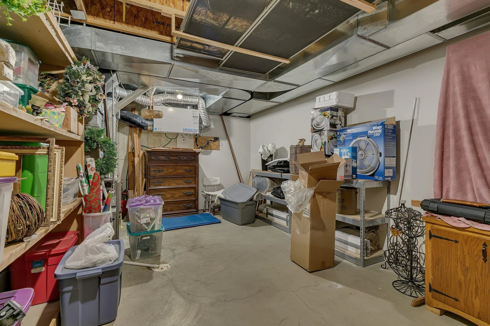 Lower level furnace room doubles as a storage room. Ample space for all your storage needs. There are 3 additional storage areas in the lower level as well.
