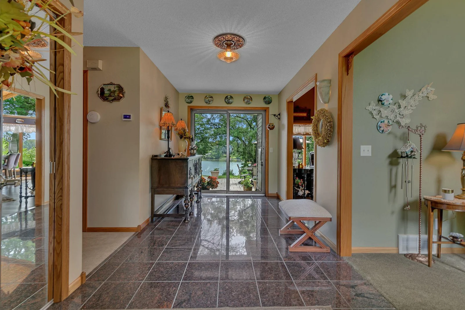 Welcome to the lake! View of the foyer looking towards the lake. The patio door leads out to the paver patio where you can enjoy the hot tub!!
