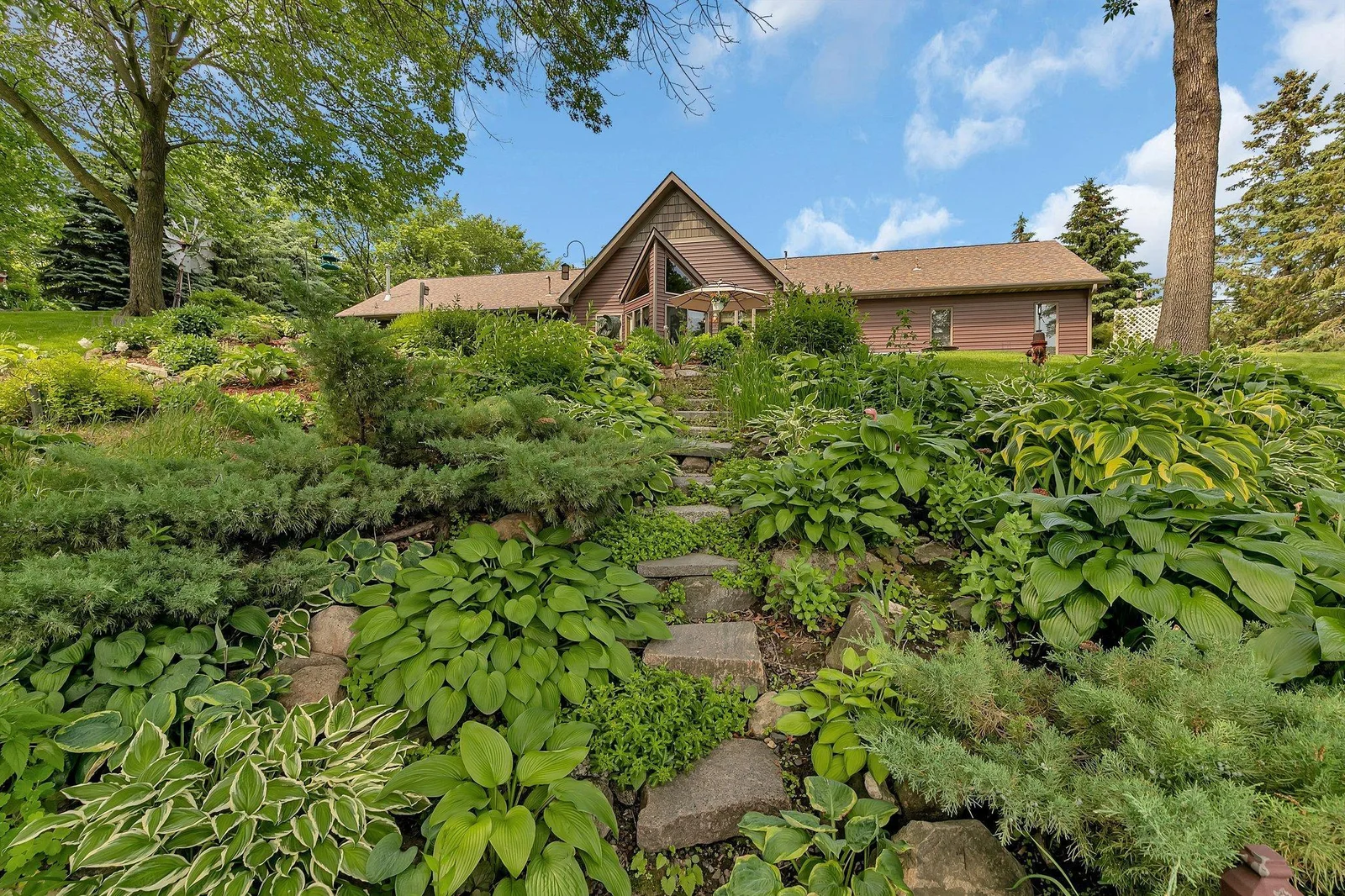 Gardens galore! Flagstone steps leading to the steel steps that lead to the lake.