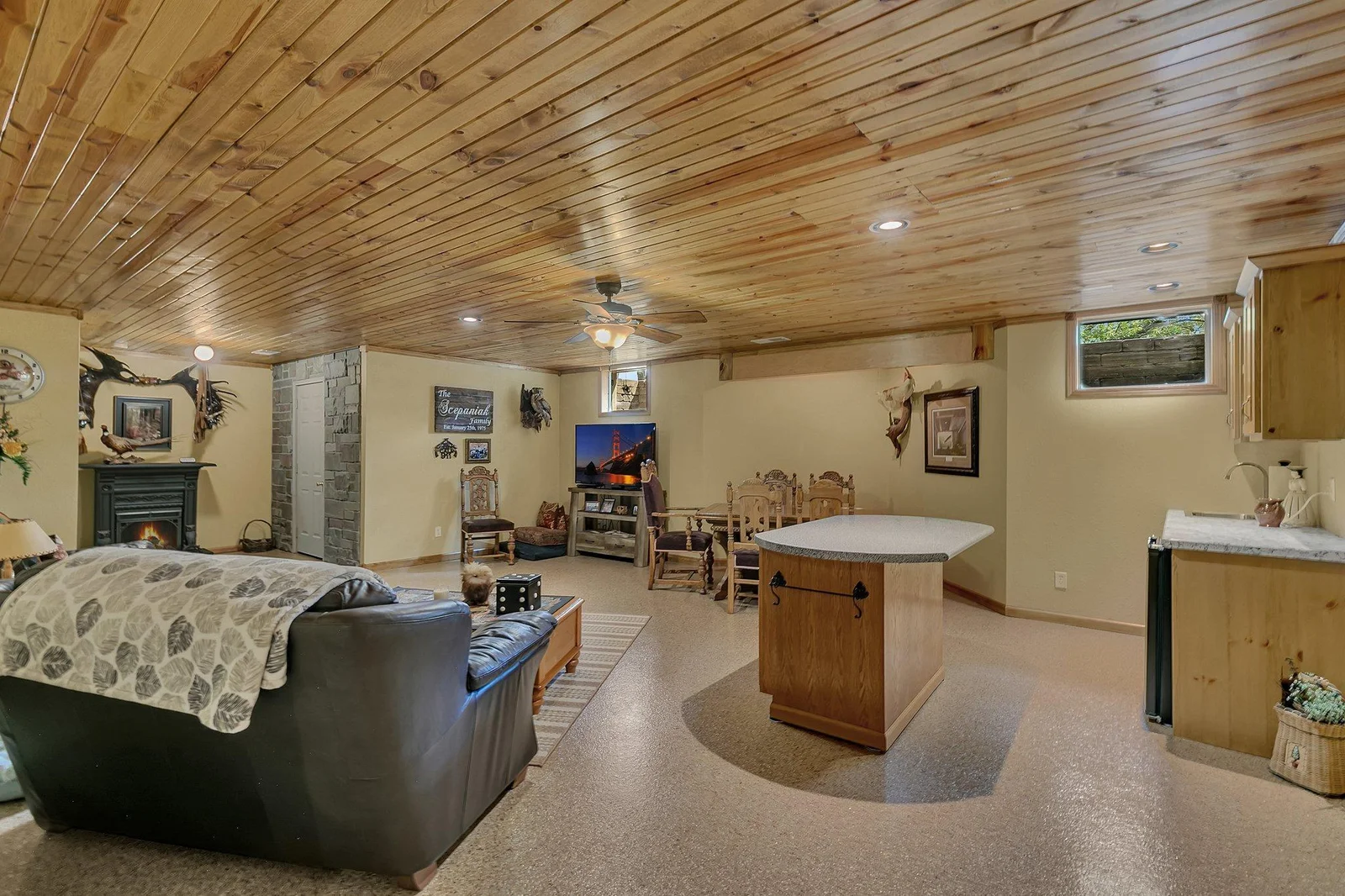 View showing all of the lower level family room. This custom home has been thoughtfully laid out. Island does not stay with the property.