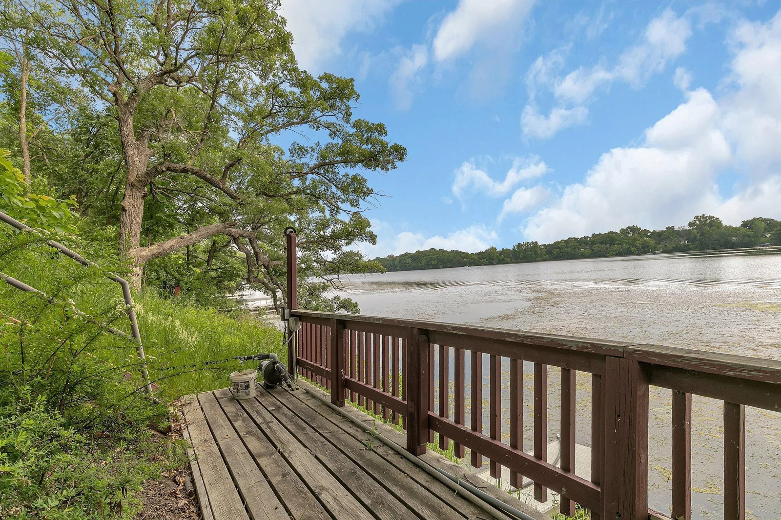 Lakeside deck/landing area. Home has irrigation which is ran off of the lake pump. This home will not disappoint.