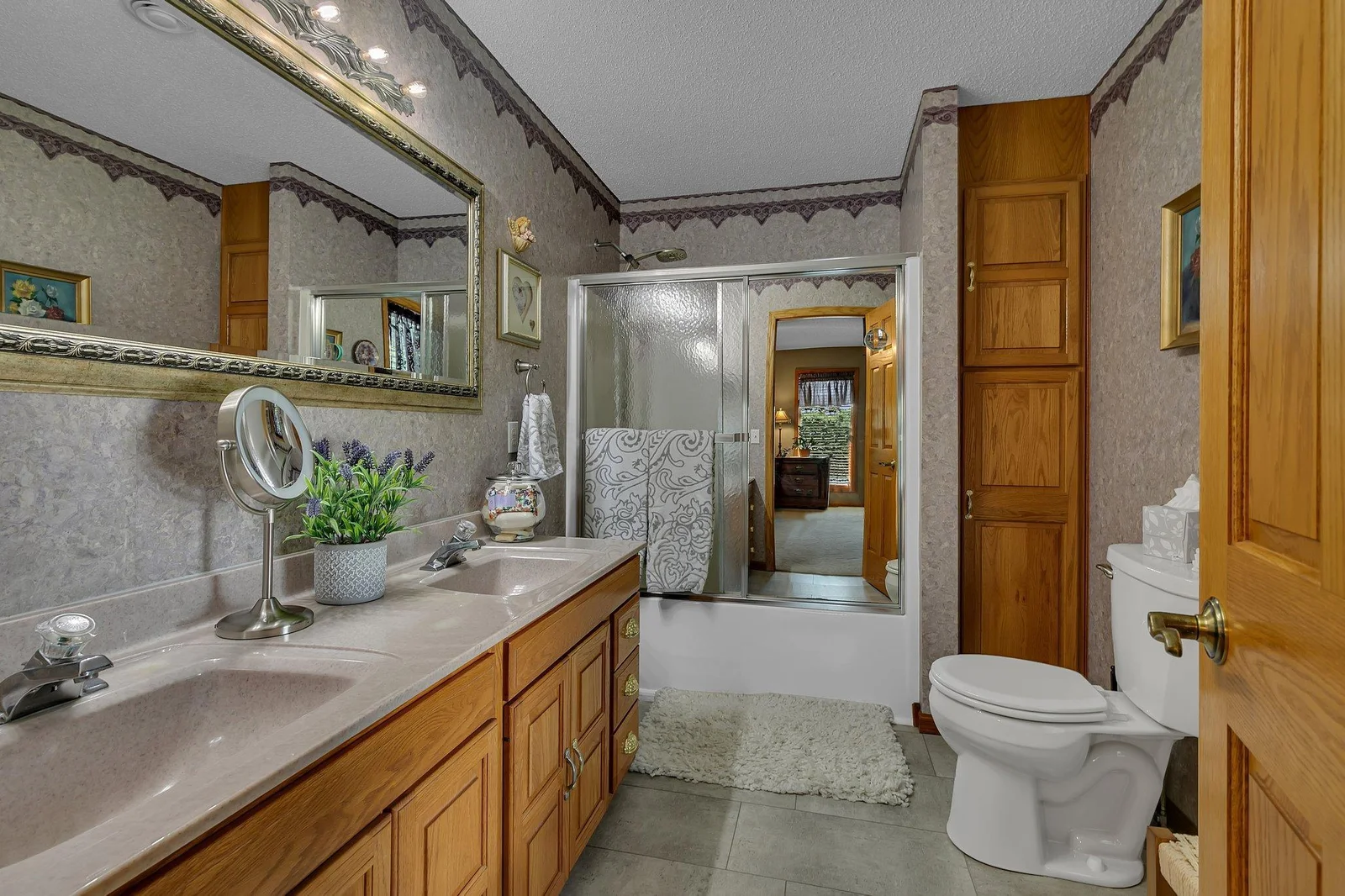 Full private ensuite with tile floors, double sinks and large linen closet.