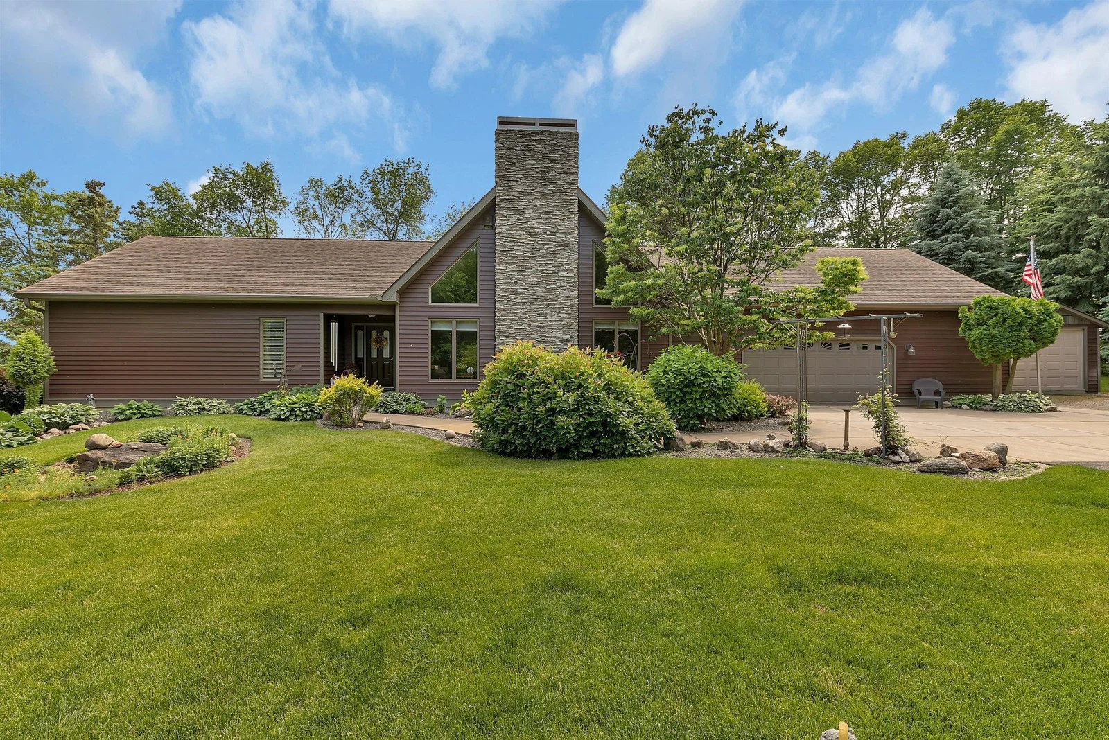 You will love lake life living in this custom built home. Offering .85 acres, 174 ft of lakeshore, mature perennial gardens, large paver patio, custom features not found elsewhere.