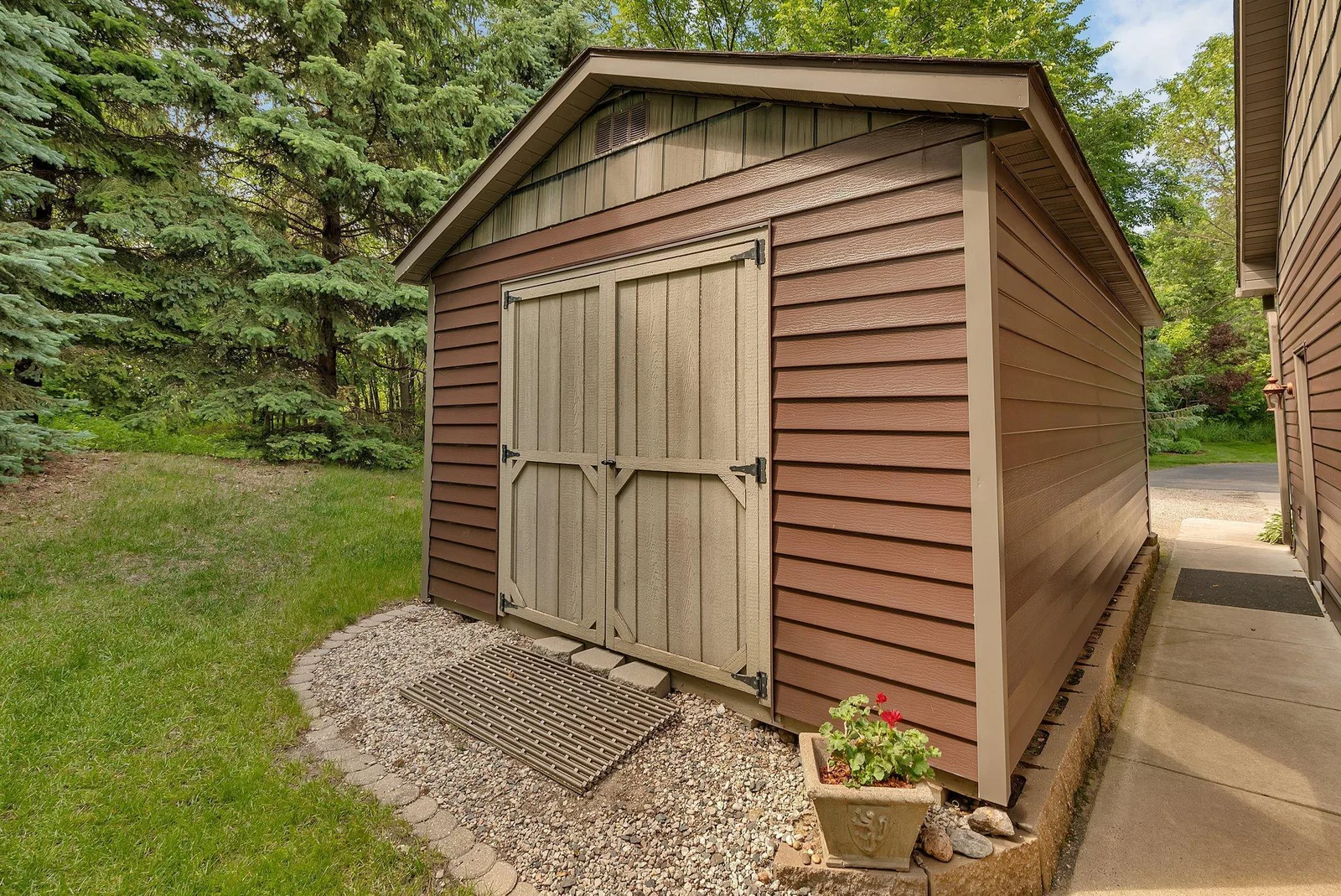 Back of the single stall garage is perfect for storing all your garden tools and lake items. It is large enough to fit a Jeep. This is on skids & could be moved if needed.
