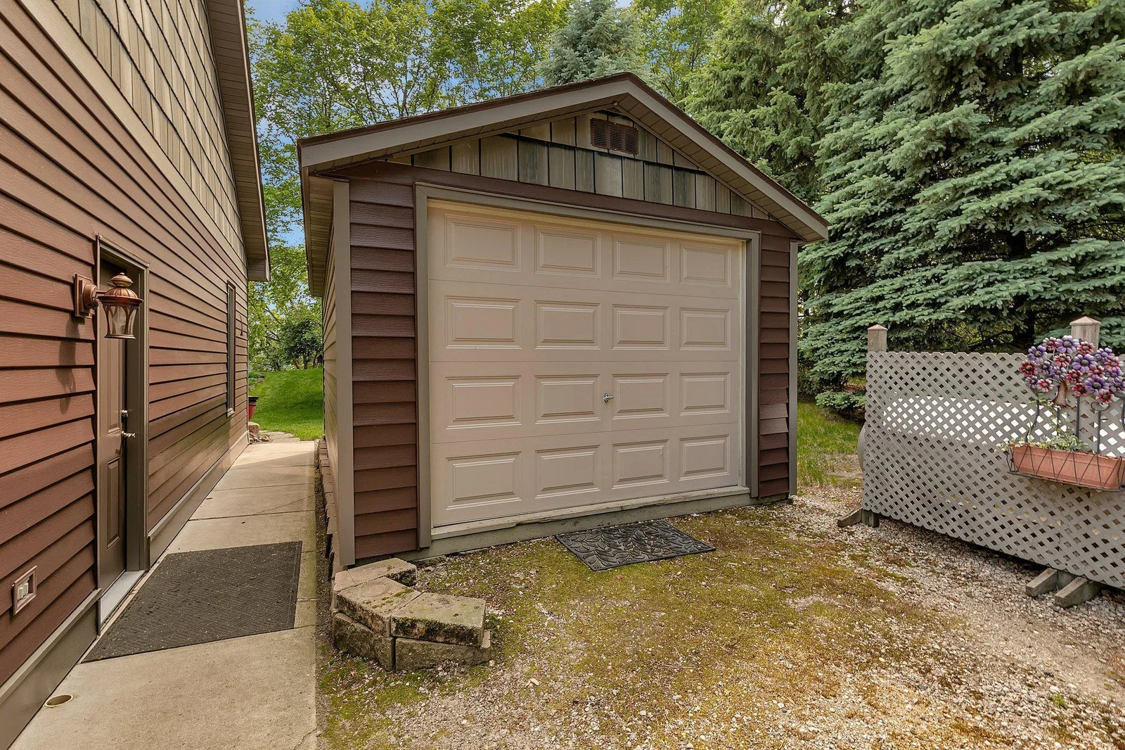 Single car garage is on skids. It is large enough to fit a Jeep. This would be great for all your gardening or lake needs. Come see all this home has to offer!
