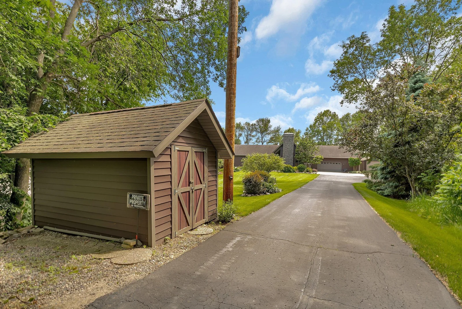 Private driveway showing the garden shed location in location to the home.