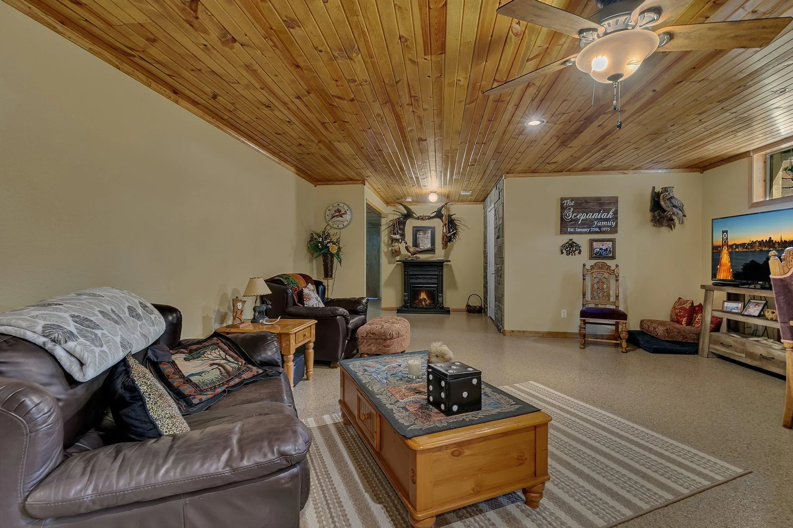 Another view of the lower level family room. This space is amazing with the wood ceiling & epoxy floors.