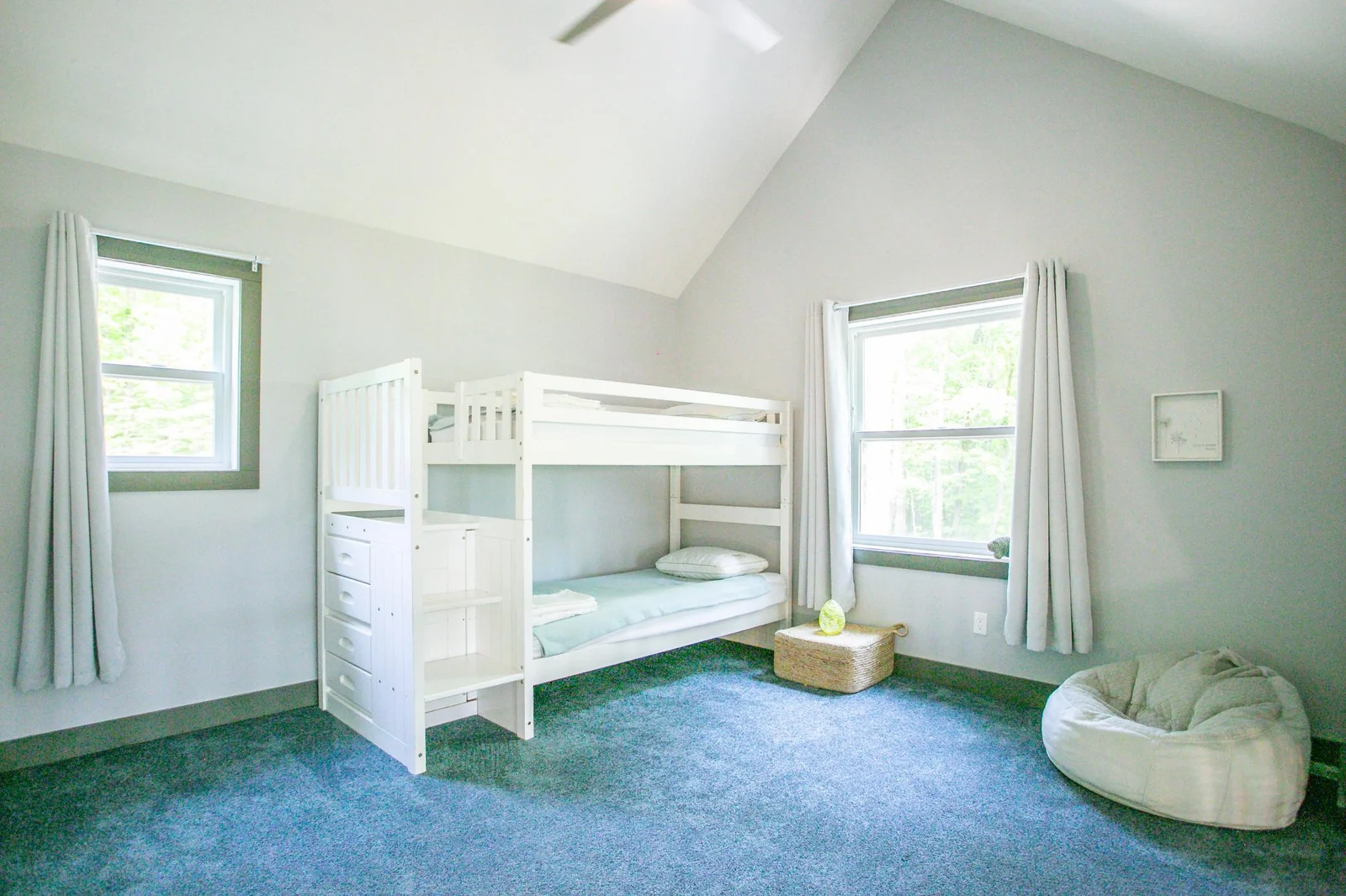 Open loft with high ceilings, being used as sleeping area, can be used for additional living space or office