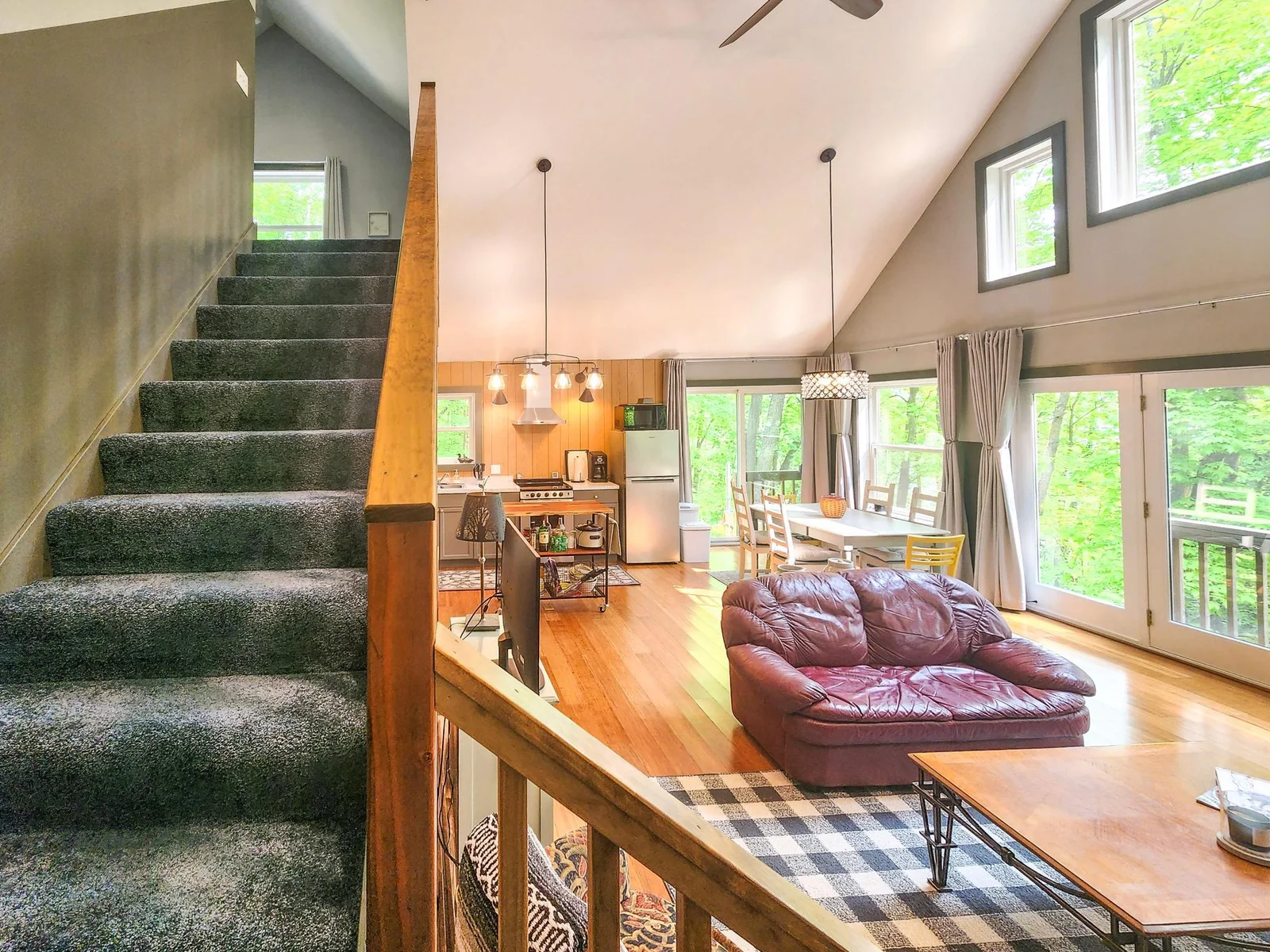 Carpeted stairs headed up to loft and 2nd bedroom