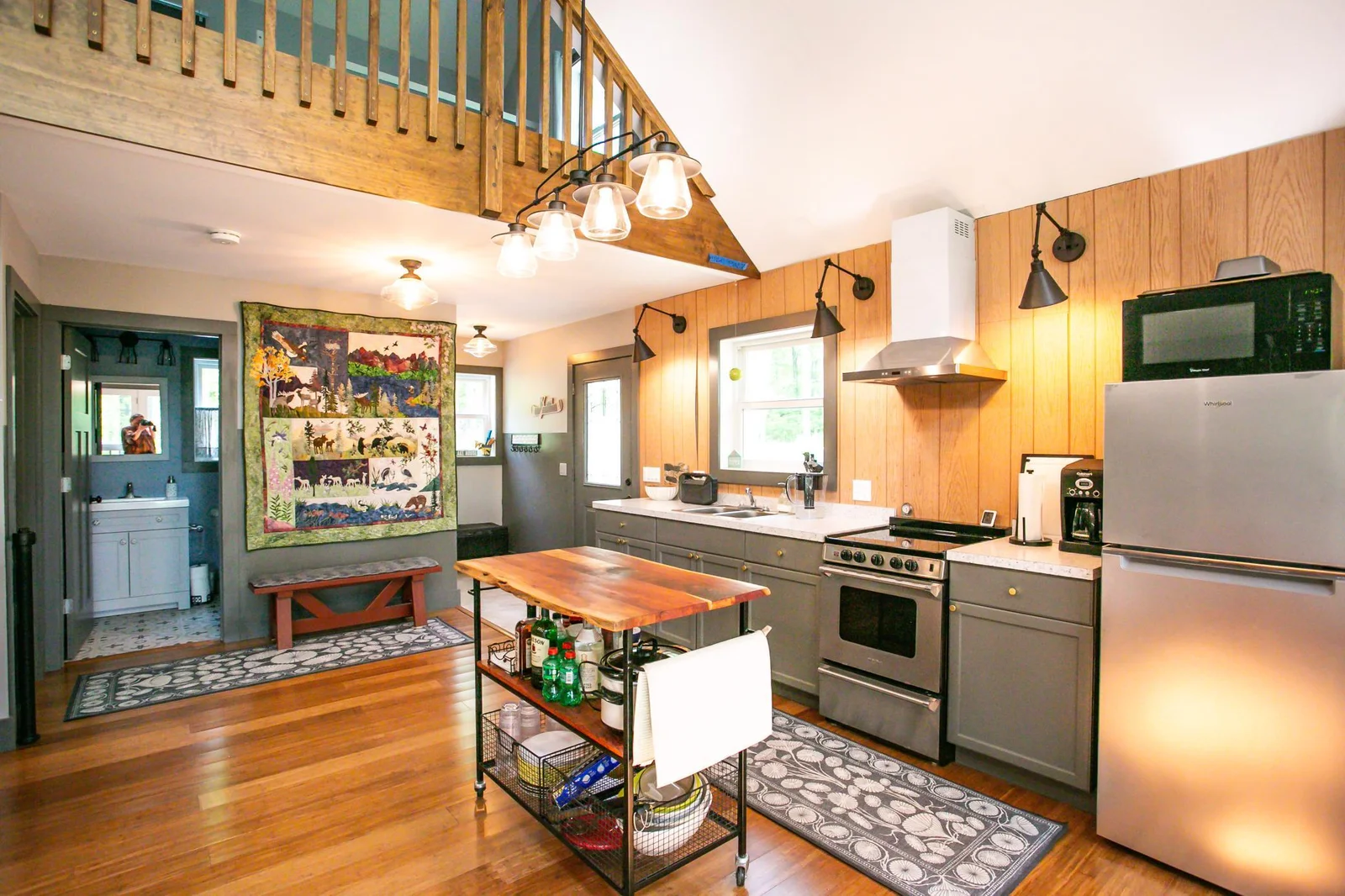 Kitchen from living area, entry and bathroom