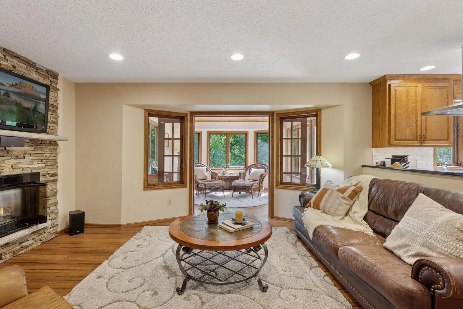Great Room with gas fireplace, stone hearth & built-ins