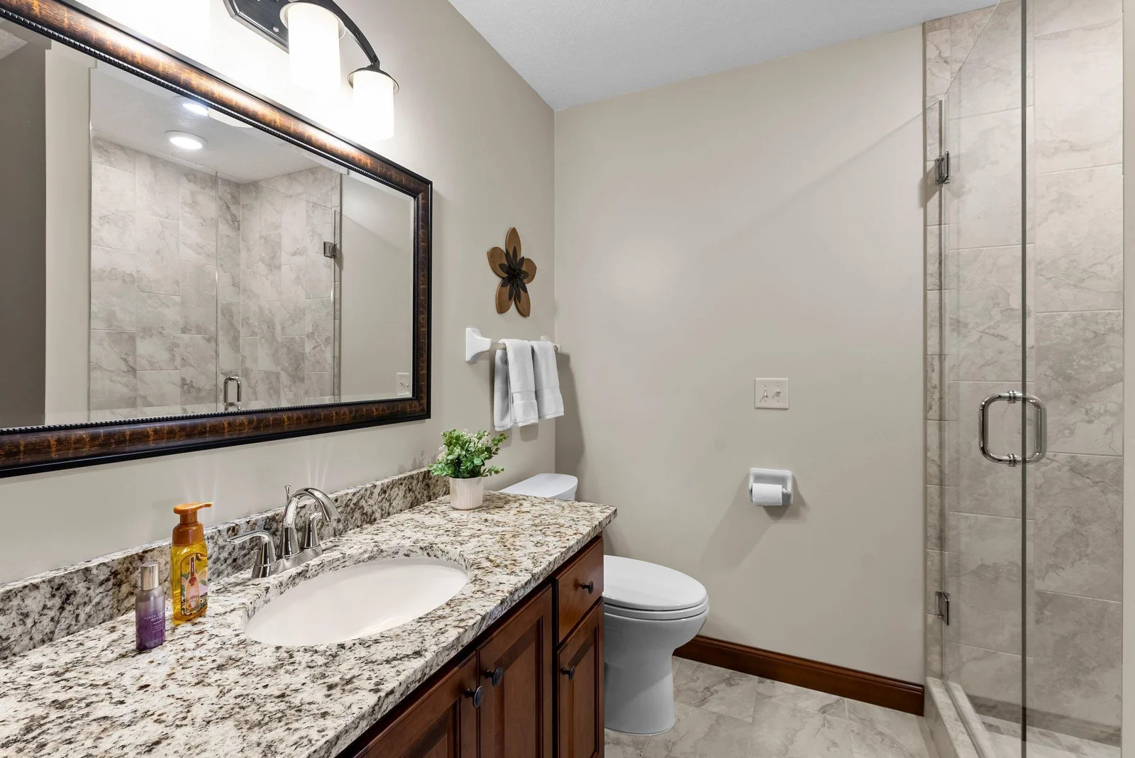 A 3/4 bathroom, complete with in-floor heating, ensures comfort for all who use it.