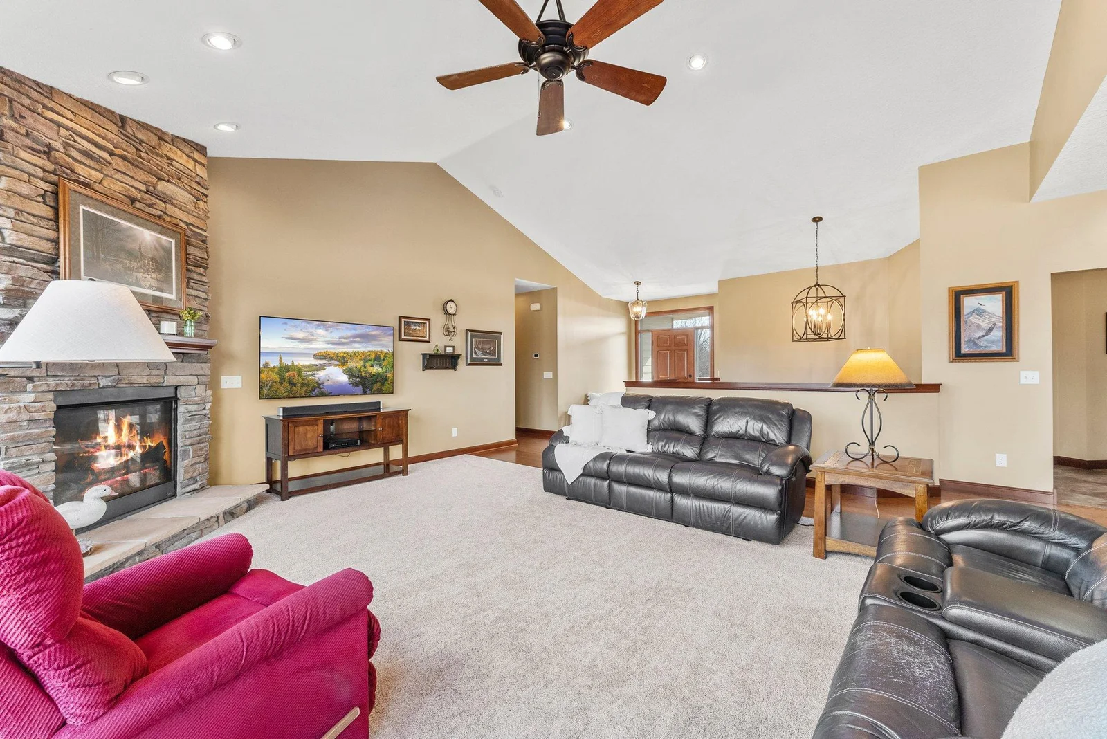 From the moment you step inside, you are greeted by a vast, open-concept living space that feels both grand and inviting. The 13' vaulted ceilings soar overhead.